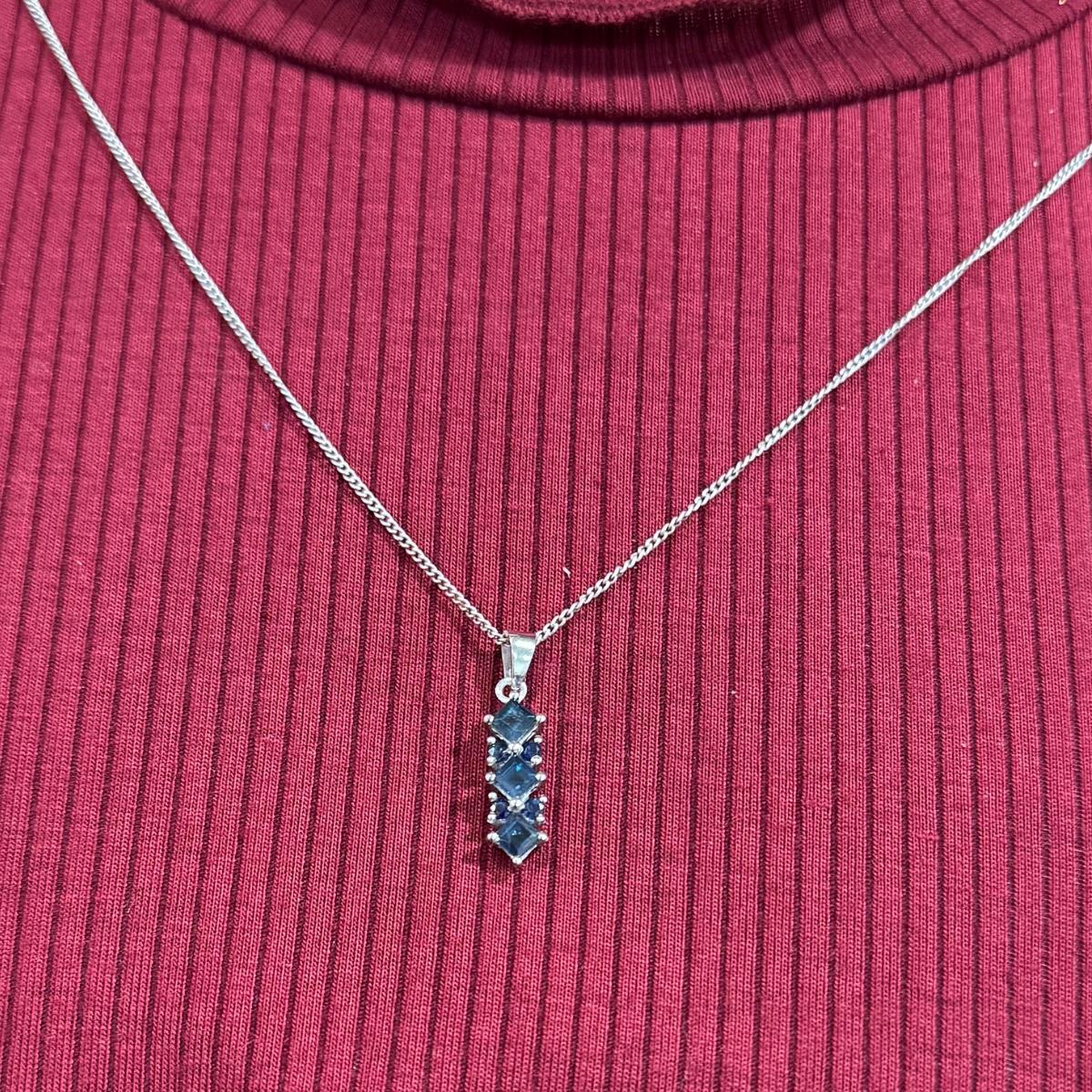 Natural Deep Blue Sapphire Long Pendant Necklace in sterling silver studded with round, square cut blue sapphire. This stunning piece of jewelry instantly elevates a casual look or dressy outfit. 
Blue Sapphire enhances the intellectual capacity of