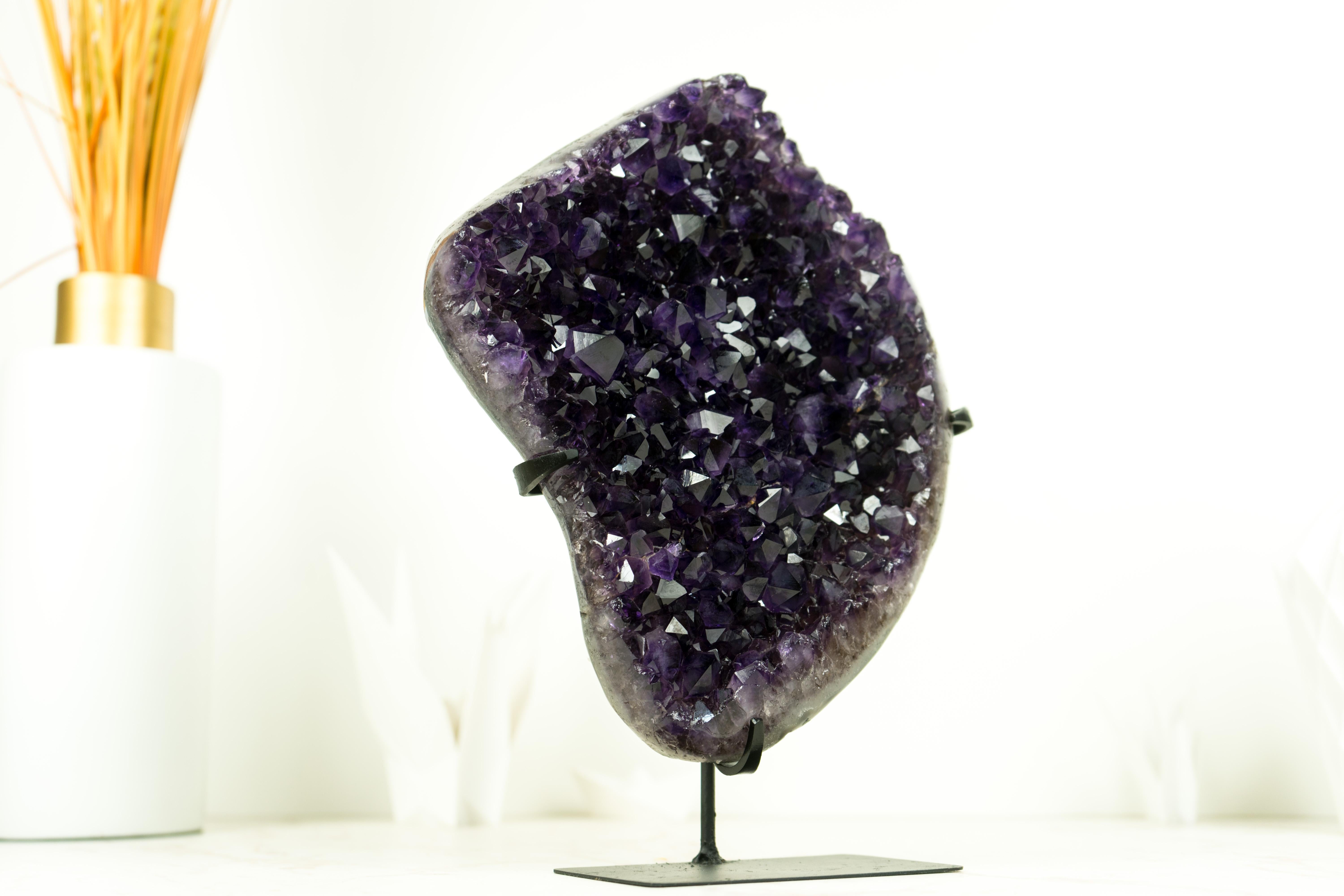 An Amethyst Cluster of exceptional beauty, this piece showcases the deepest shade of purple, AKA Grape Jelly Amethyst, on a beautifully formed Amethyst Cluster It's a truly spectacular specimen that will elevate the space of your home, office, or