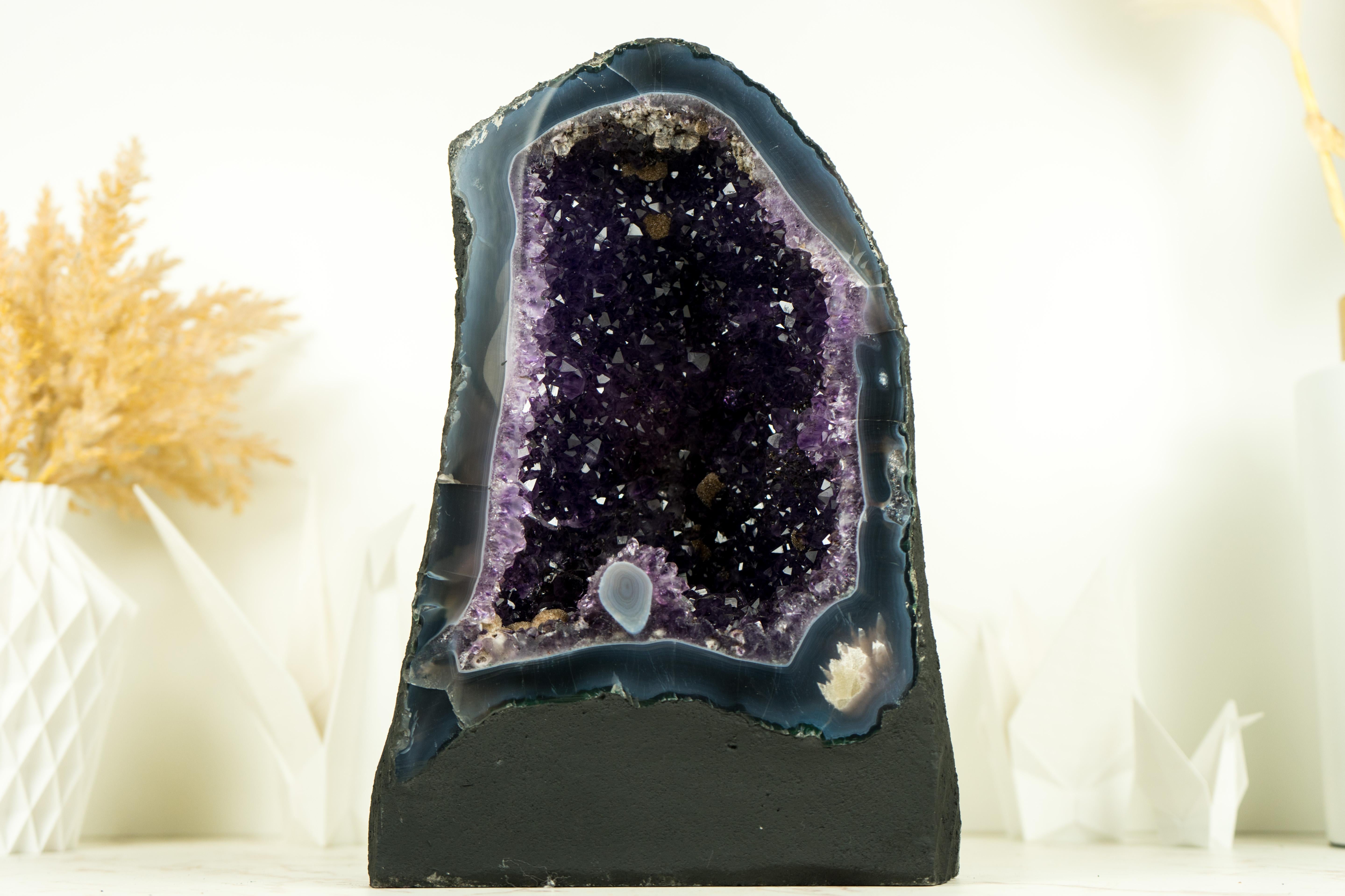 With a gorgeous natural formation and bringing unique beauty, this amethyst with agate geode is a natural form of art to display as a focal point in your space or a beautiful natural sculpture on your table.

The Amethyst druzy is considered to be