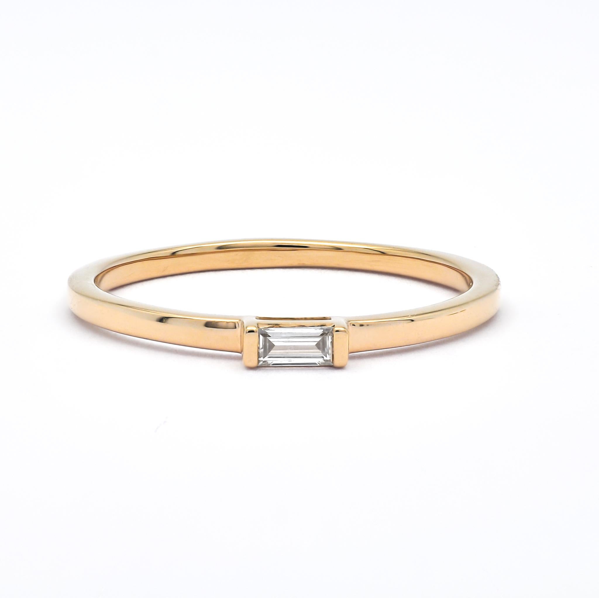 Behold the 18kt Rose Gold Natural Diamond Solitaire Baguette Ring, a masterpiece of grace and refinement. Crafted with precision from 18kt Rose gold, this ring features a Baguette cut 0.06-carat natural diamond in a classic solitaire setting.

 Its
