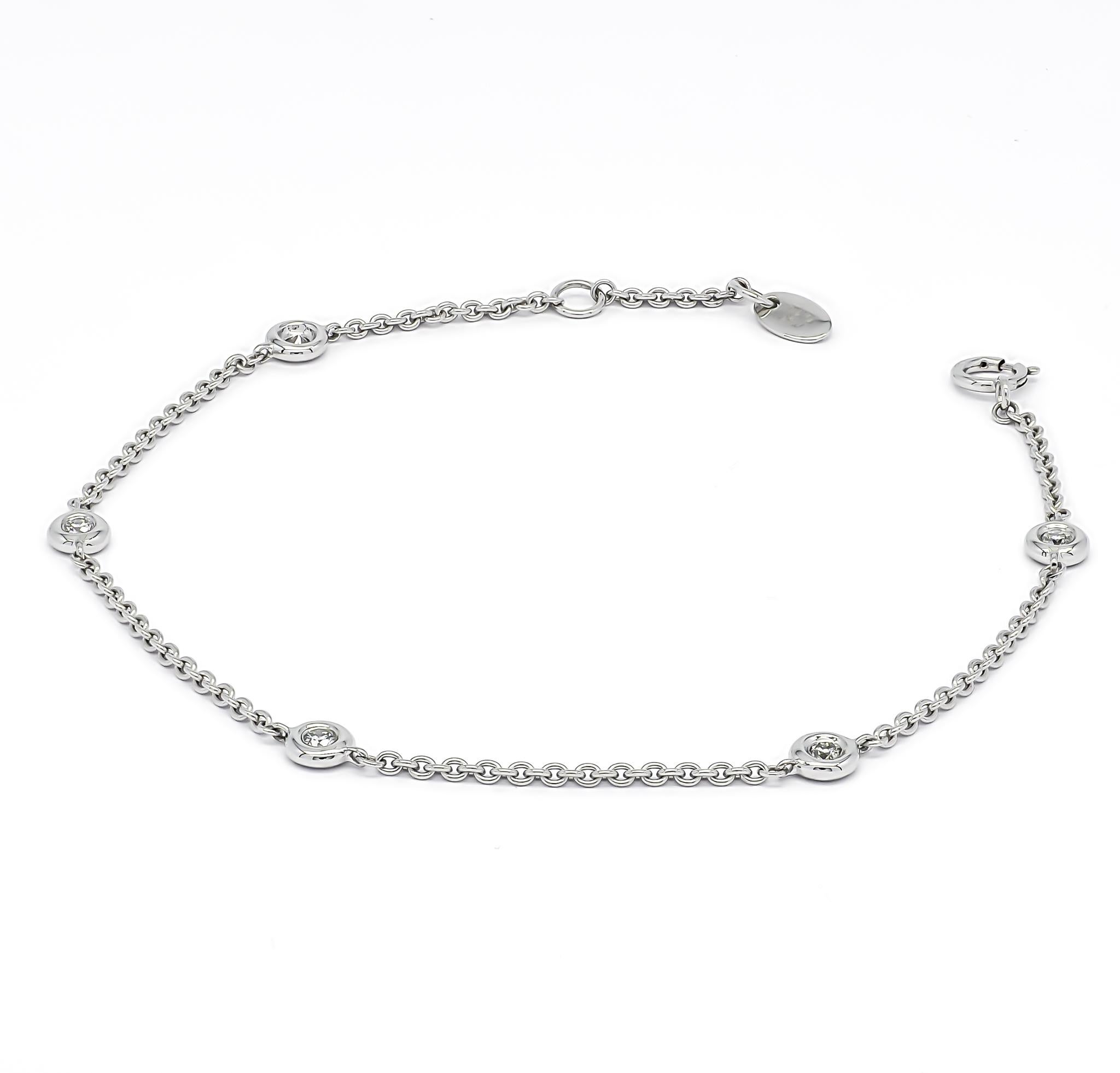 Immerse yourself in the delicate beauty of this exquisite bracelet, artfully crafted in 18k white gold. The bracelet showcases a captivating display of soft shimmering chain links, gorgeously enhanced by round-shape diamonds meticulously set in