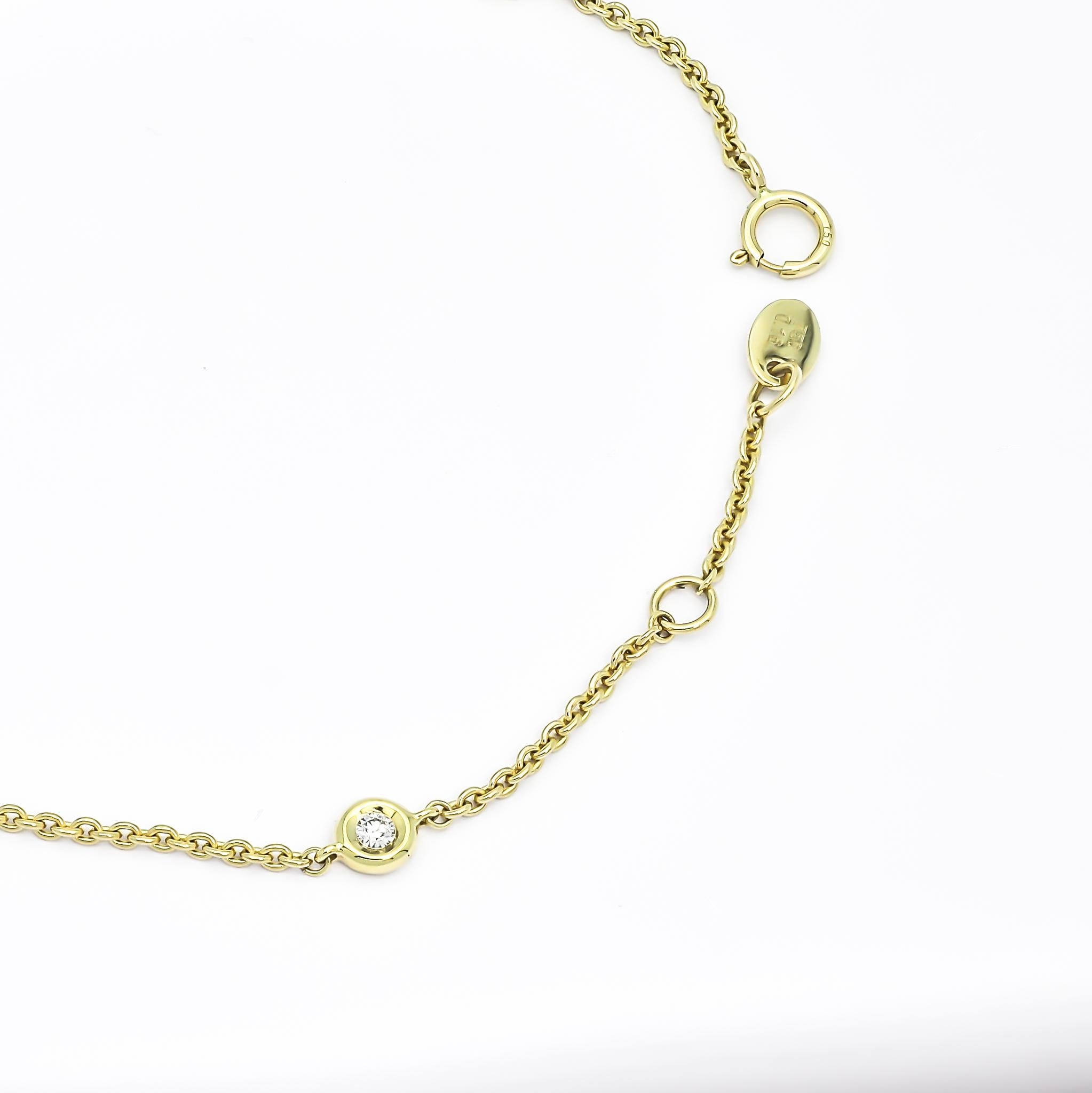 Immerse yourself in the delicate beauty of this exquisite bracelet, artfully crafted in 18k Yellow gold. The bracelet showcases a captivating display of soft shimmering chain links, gorgeously enhanced by round-shape diamonds meticulously set in