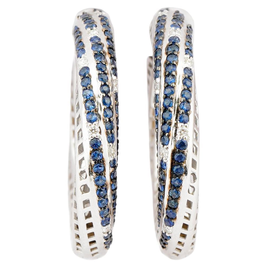 Diamante naturale 0,18cts e zaffiro blu 1,48 in oro 18k