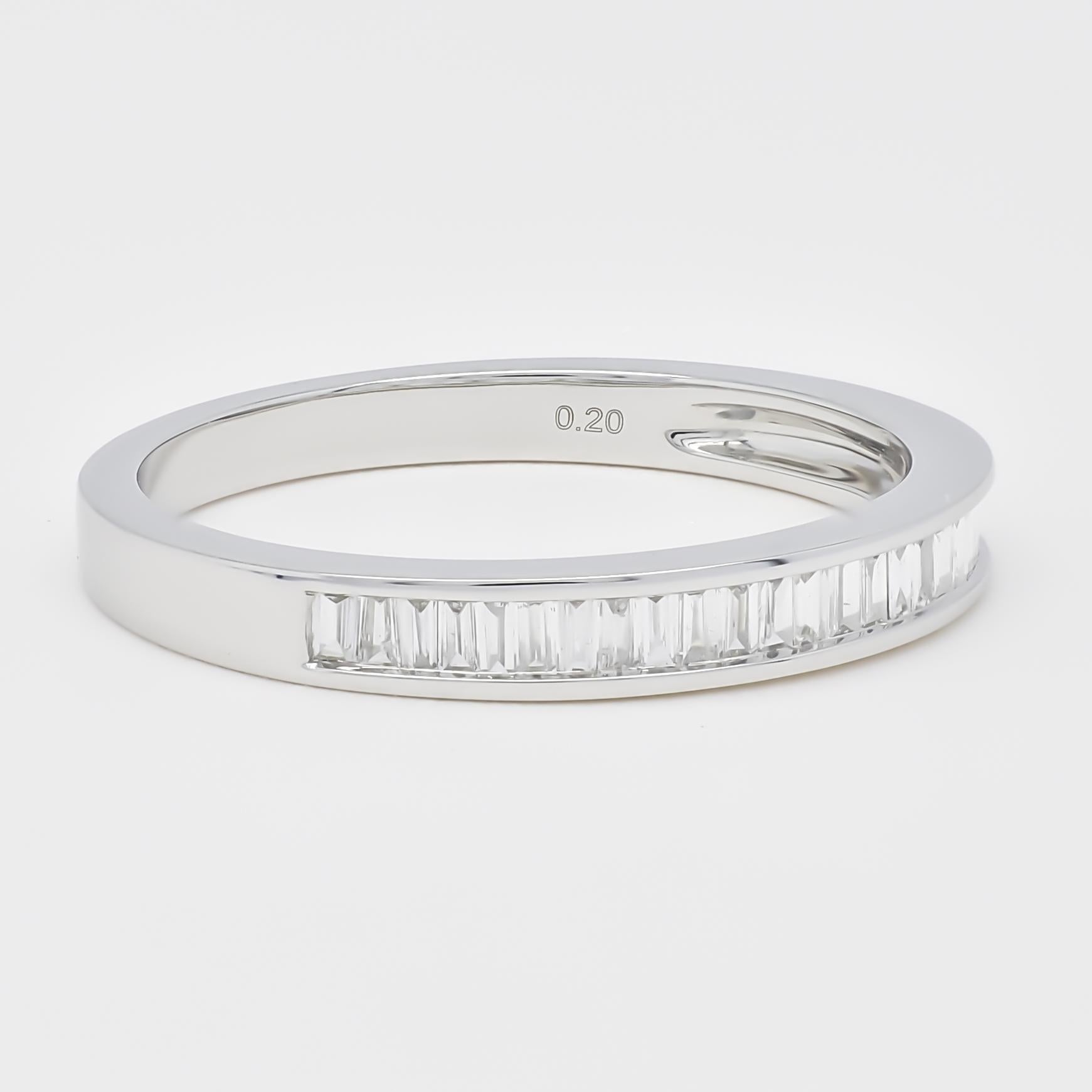 Celebrate your eternal bond with this sparkling Baguette Diamond Half-Eternity Band, a symbol of everlasting love. Crafted in luxurious 18KT White gold, this elegant band features a seamless row of baguette diamonds, totaling 0.22 carats. Each