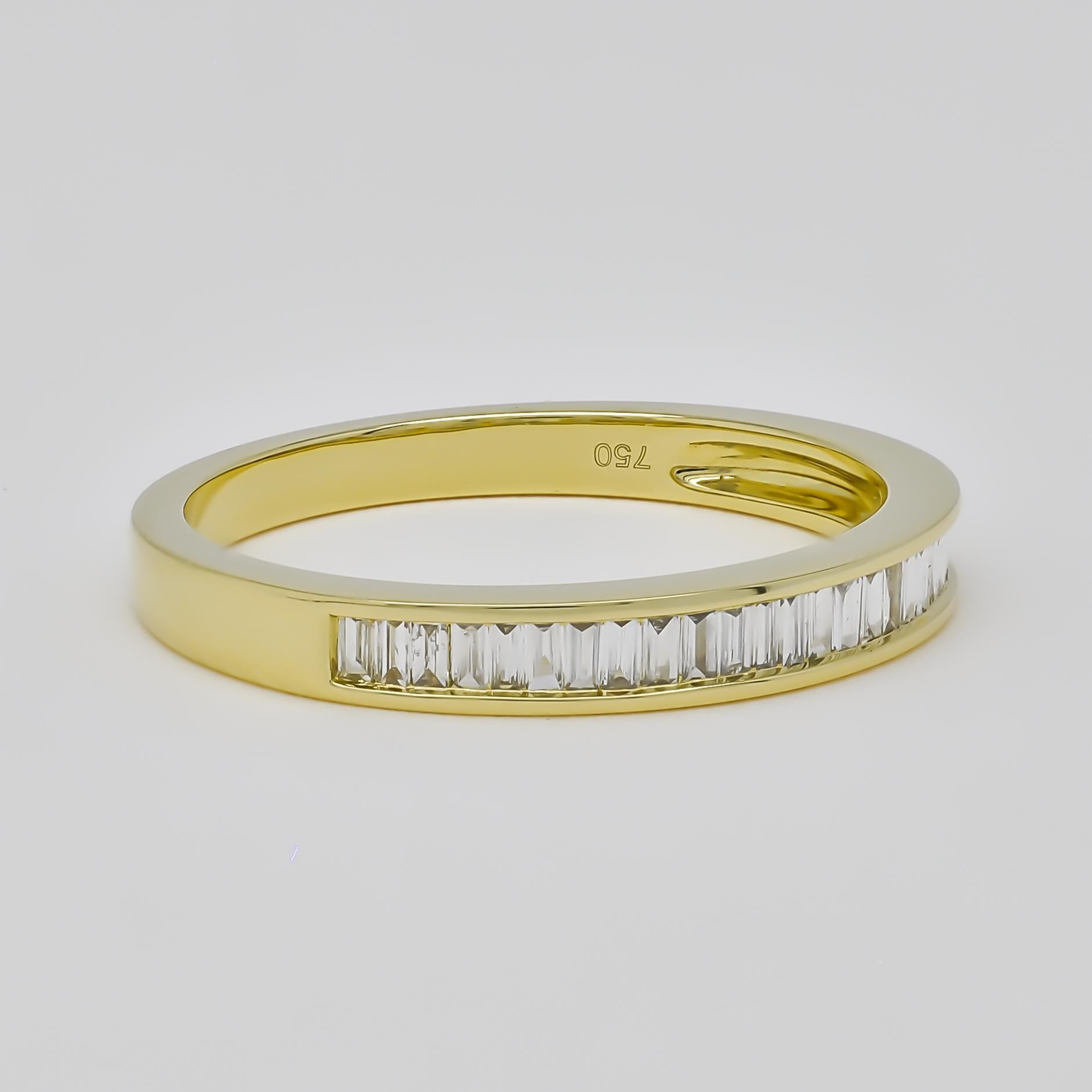 Celebrate your eternal bond with this sparkling Baguette Diamond Half-Eternity Band, a symbol of everlasting love. Crafted in luxurious 18KT Yellow gold, this elegant band features a seamless row of baguette diamonds, totaling 0.22 carats. Each