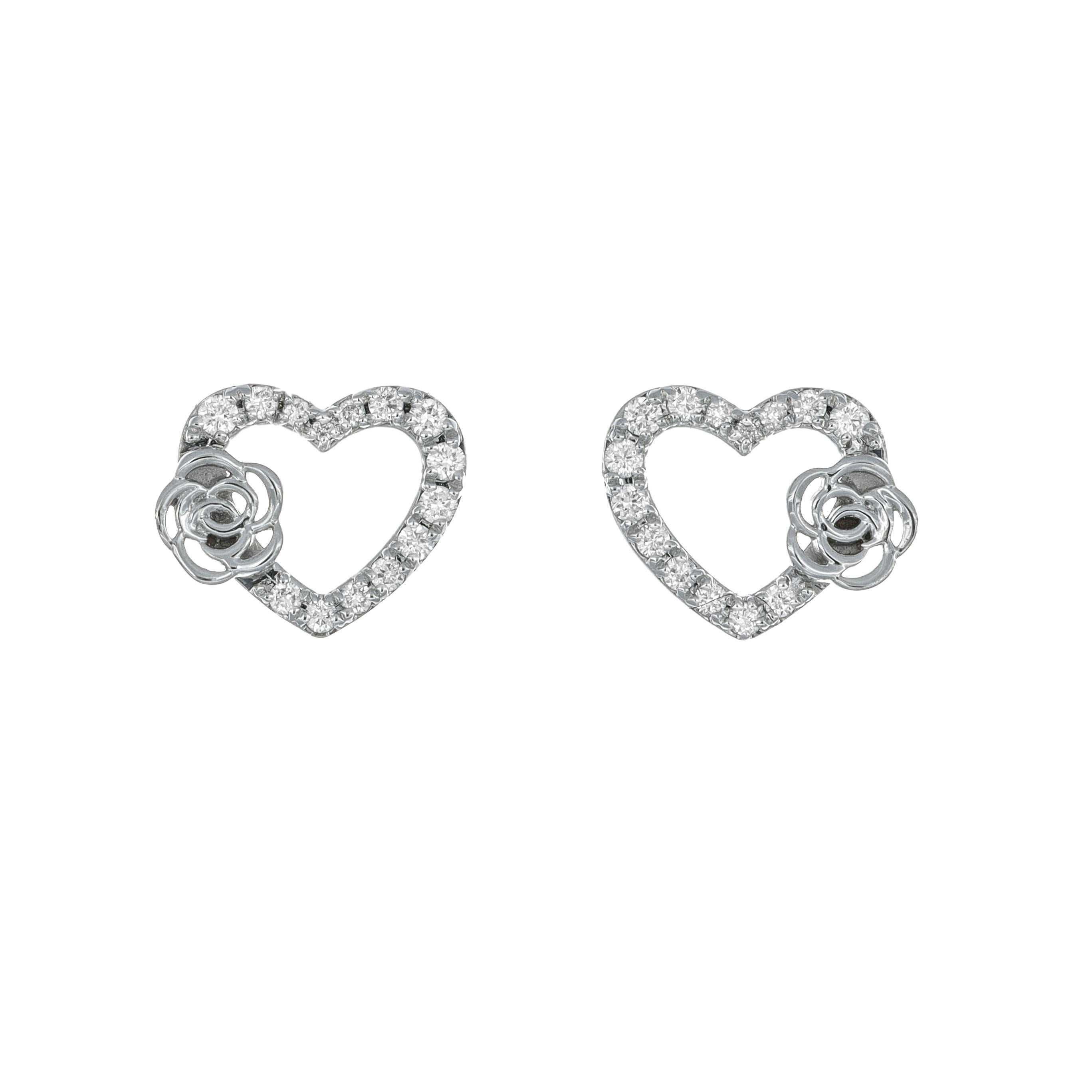 At the heart of each earring lies a captivating arrangement of diamonds, meticulously set to form the outline of a contemporary heart shape, adding a touch of femininity, is the rose flower motif delicately adorns each heart, infusing the earrings