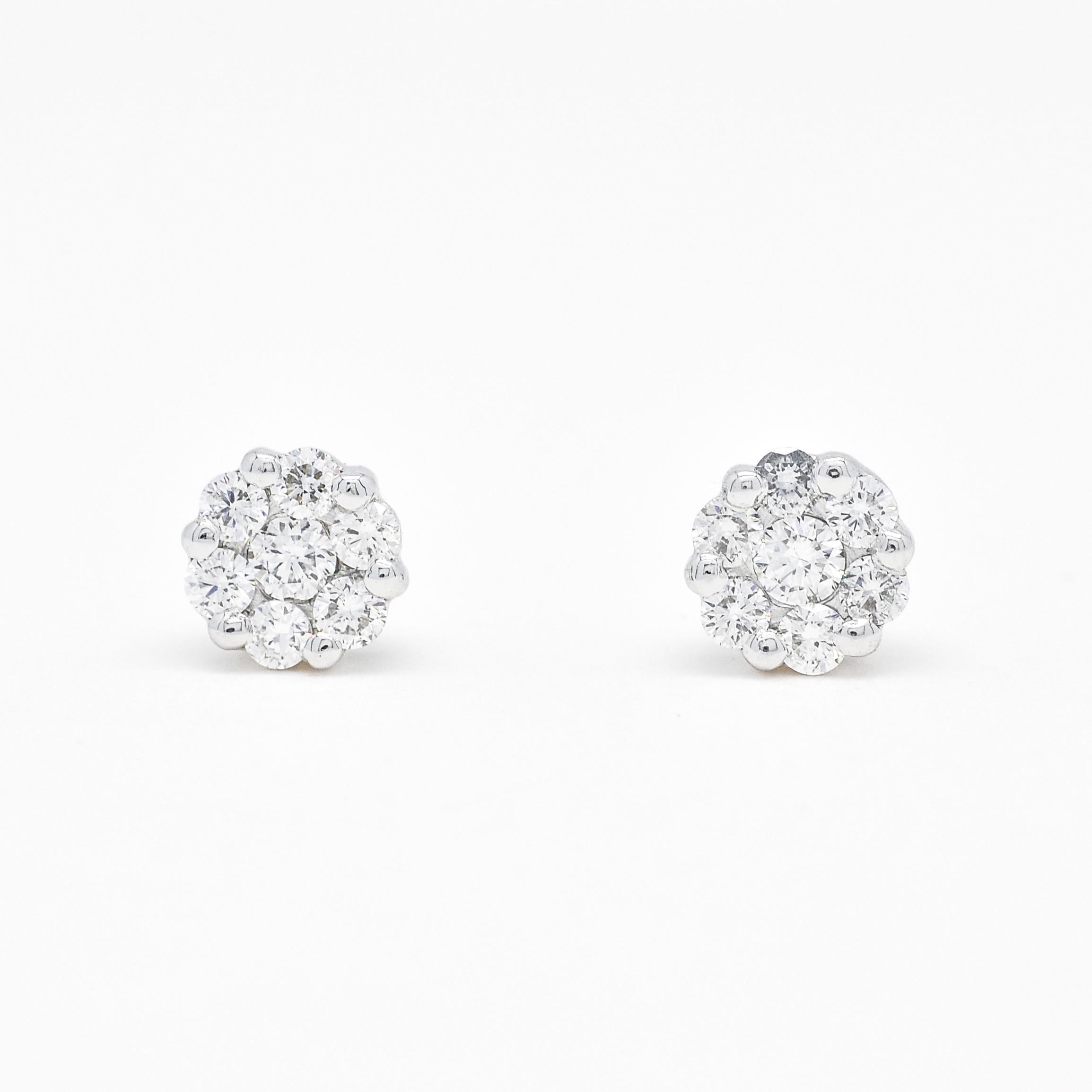 Petite and sweet, these diamond cluster stud earrings are an elegant addition to your jewelry collection. Crafted in luxurious 18 kt white gold, each earring features a delicate cluster of round-shaped diamonds, meticulously set to total 0.34