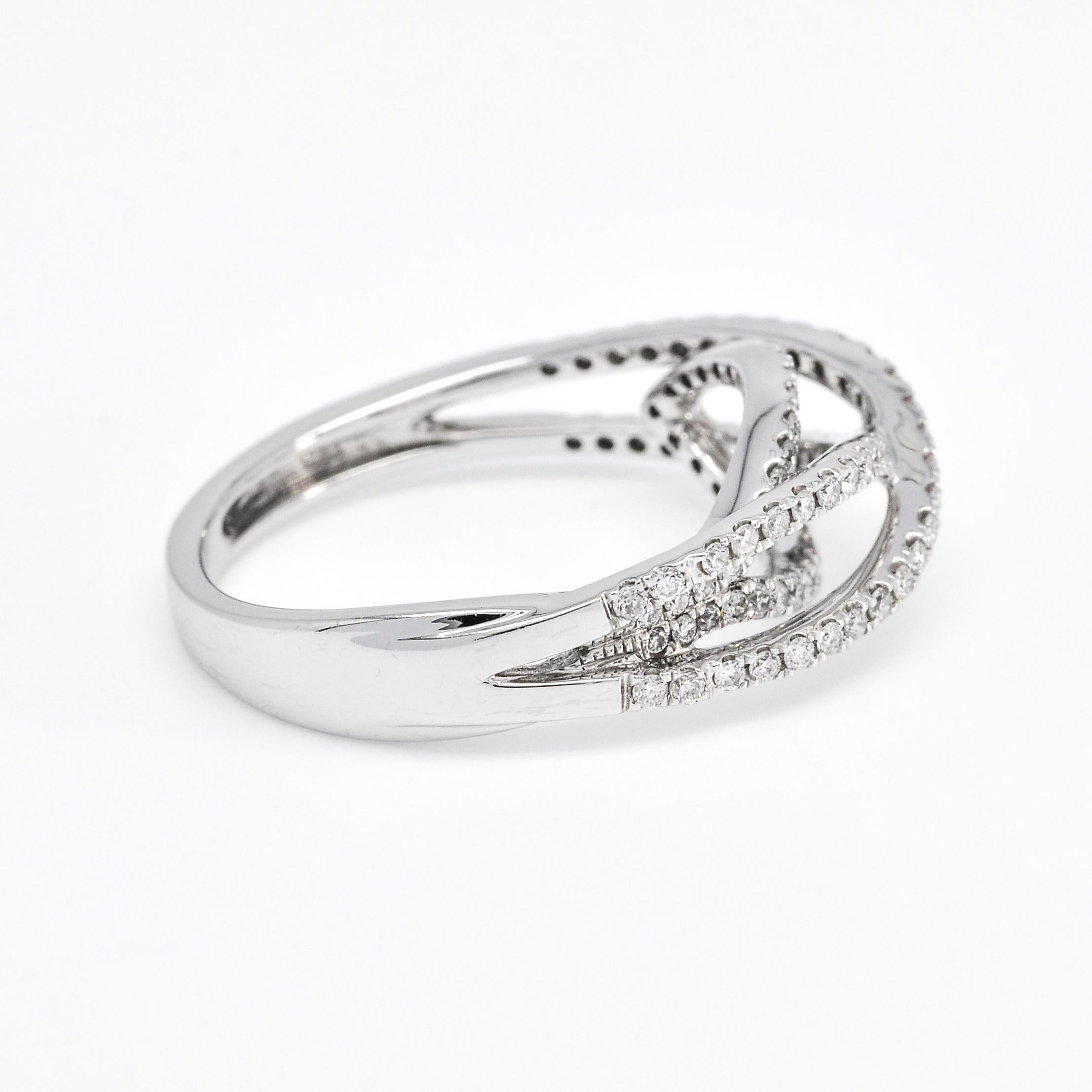 Indulge in the epitome of elegance with our stunning Multi-Row Ring, a piece that flawlessly blends contemporary design with timeless beauty. This ring is expertly crafted in 18KT white gold, providing a luminous backdrop that enhances the