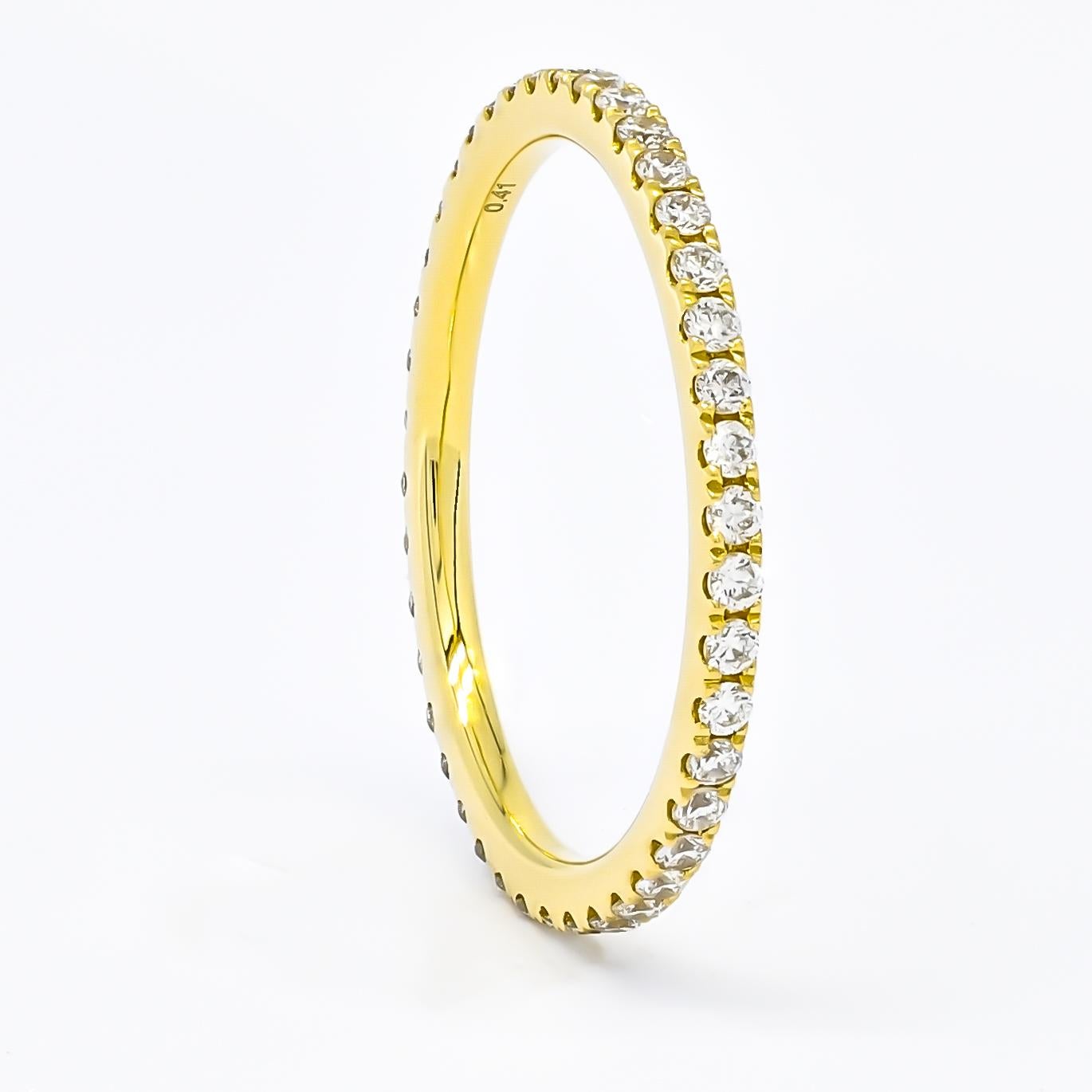 Elevate your finger with the understated opulence of this sparkling diamond band, meticulously crafted in the finest 18k Gold. Each facet of this exquisite piece speaks volumes of sophistication and refinement, from the seamless procession of