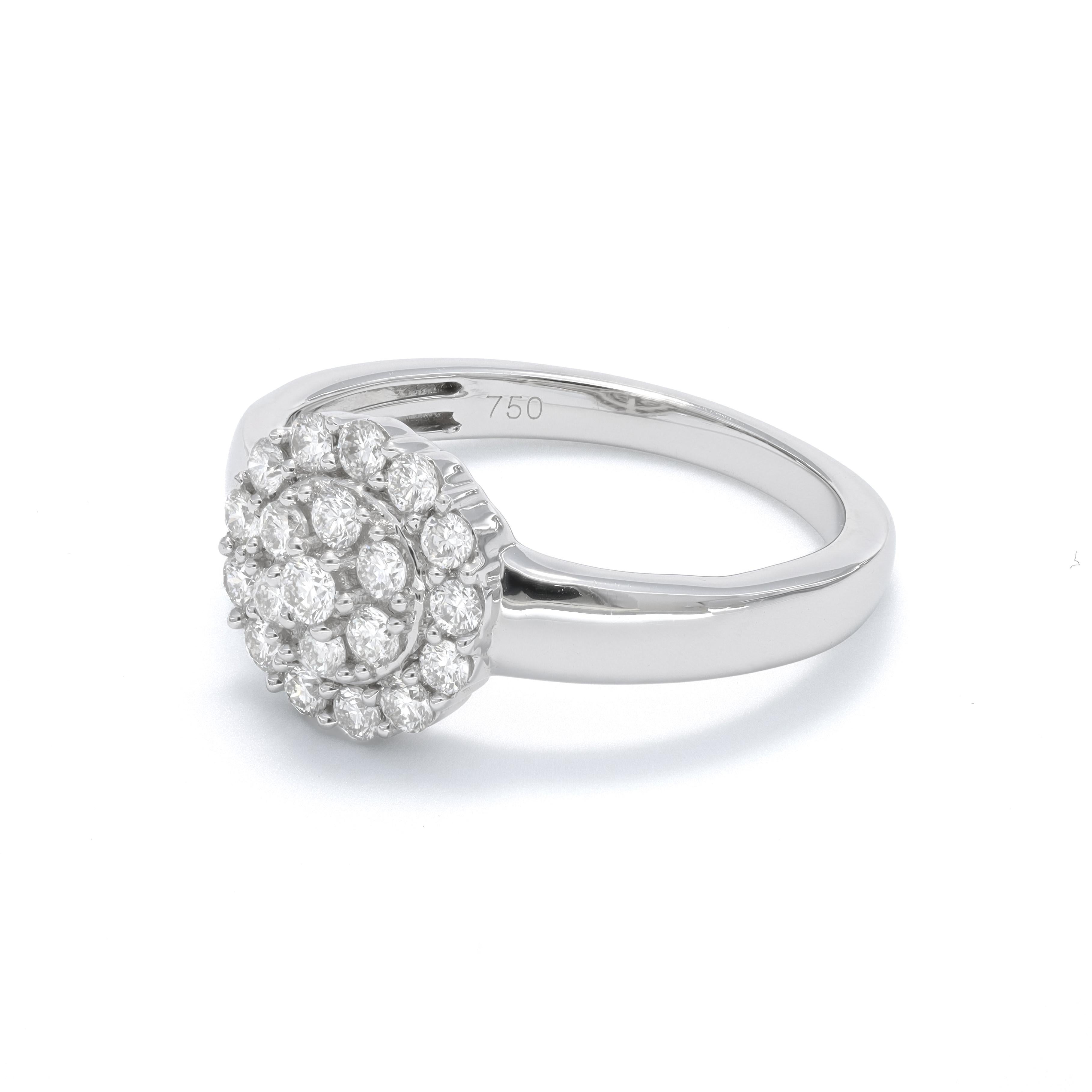 Dazzle and drama come together in this breathtaking Diamond Halo Cluster Engagement Ring, a masterpiece of elegance and craftsmanship in 18K white gold. At the heart of this stunning ring lies a round-shaped central diamond cluster, meticulously