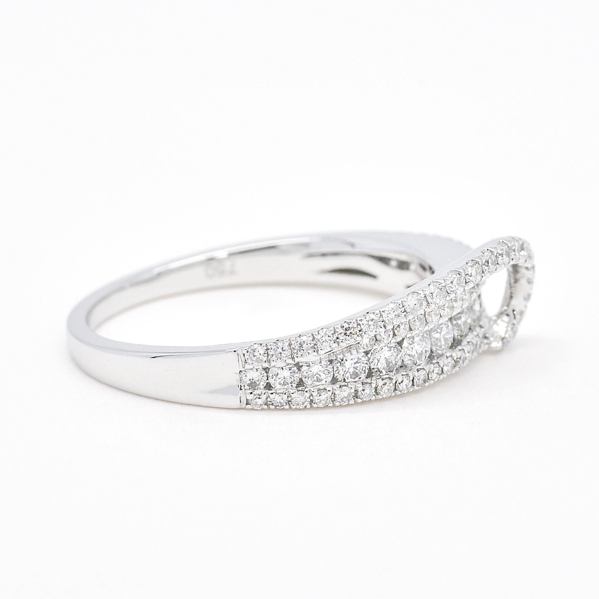 It is the breathtaking 18KT White Gold Natural Diamond Multi Row Swirl Wedding Band, a diamond band that epitomizes elegance and beauty.

This exquisite wedding band is a true work of art, meticulously crafted in 18KT white gold to create a stunning
