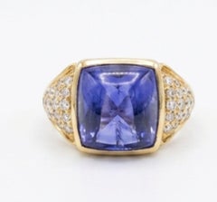 Anello in oro 14k con diamante naturale da 0,62 carati e tanzanite da 10,90 carati