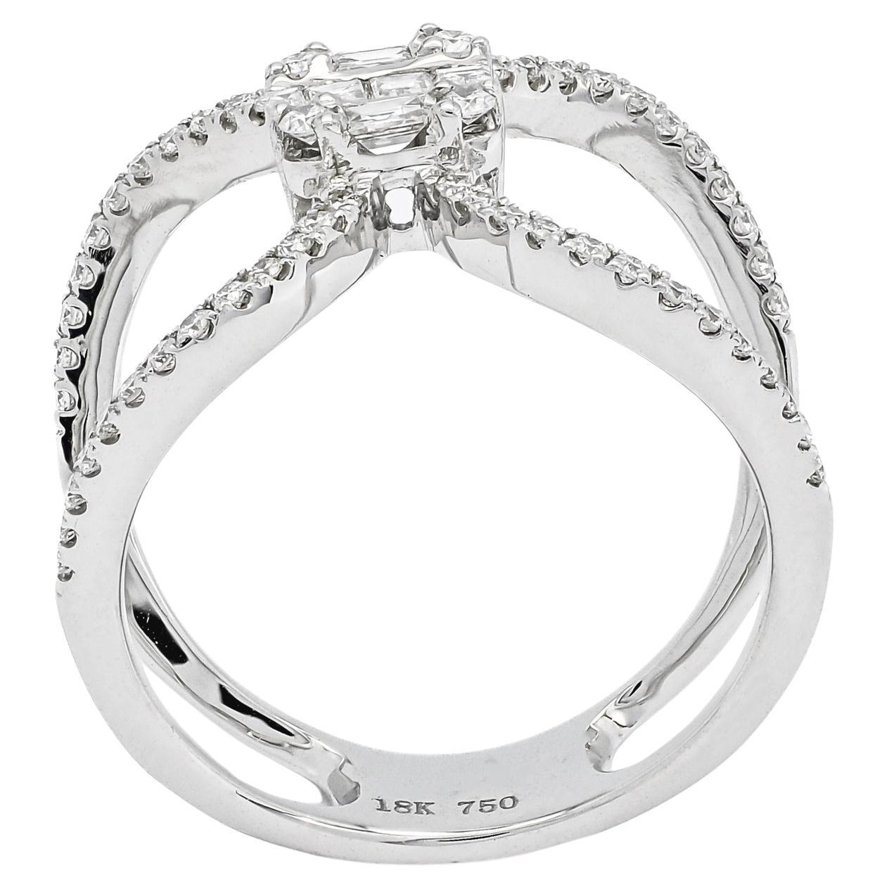 Immagina il fascino accattivante di questo anello da cocktail, il cui punto focale è il cuore: un grappolo di diamanti scintillanti meticolosamente disposti in un'accattivante formazione di tagli baguette e rotondi. Con un peso totale di 0,70 carati