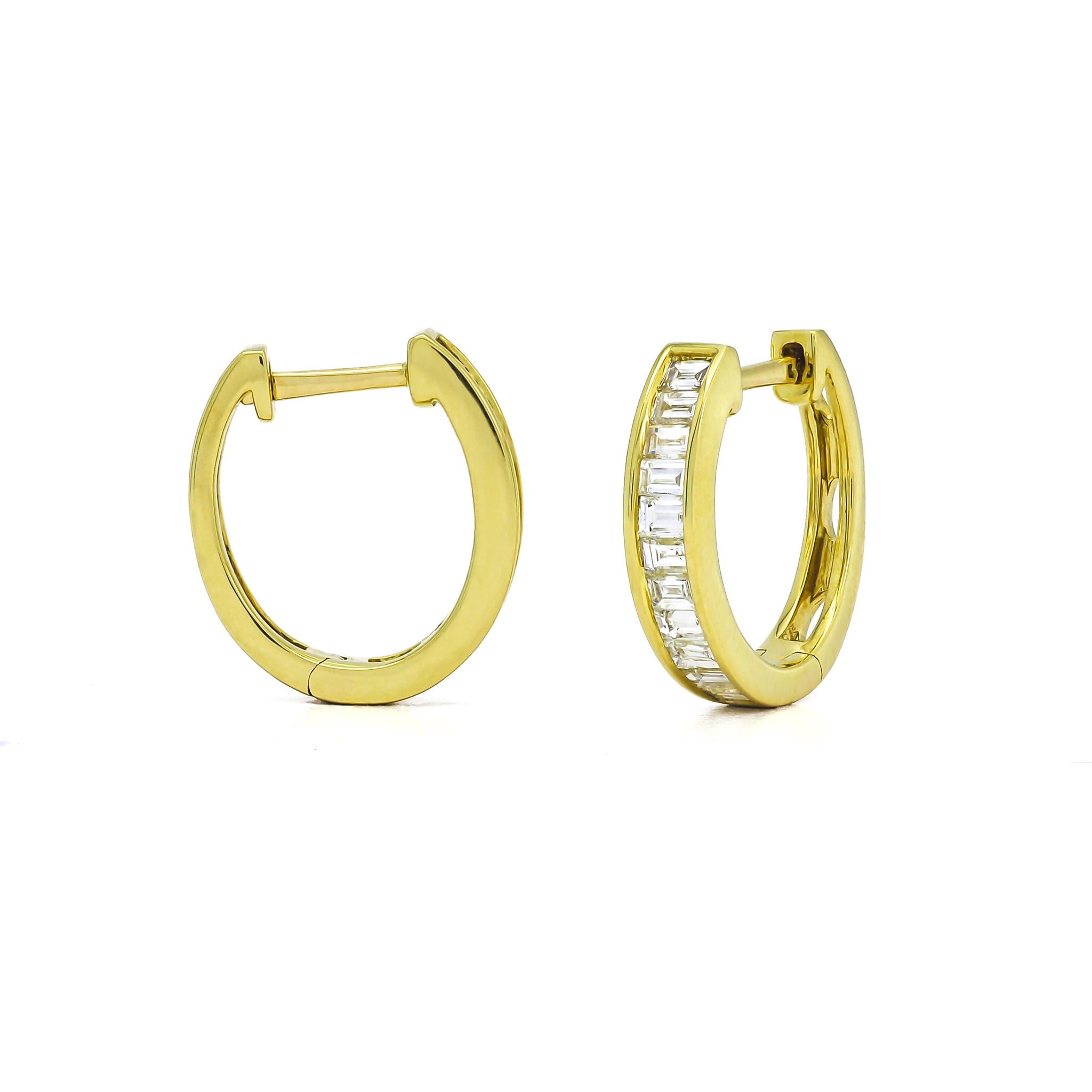 Introducing our 18KT Gold Baguette Diamond Half Hoop Huggies with Bezel detailing—the epitome of minimalistic bIntroducing our 18KT Gold Baguette Diamond Half Hoop Huggies with Bezel detailing—the epitome of minimalistic beauty and refined elegance.
