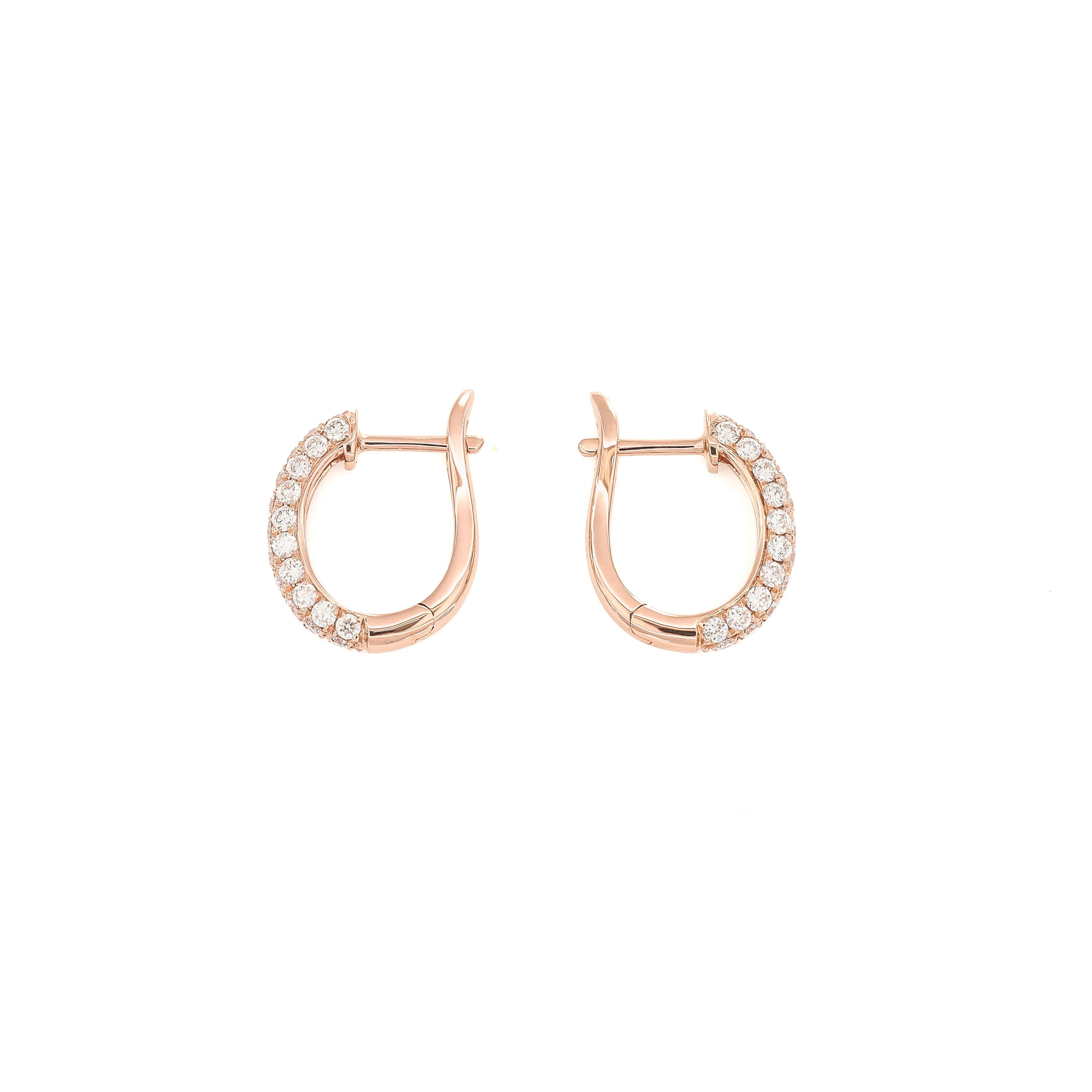 Immerse yourself in the allure of understated elegance with the Natural Diamond 0.78CT 18Karat Rose Gold Small Pavé Huggies. 

These earrings are a testament to the delicate artistry and timeless sophistication that fine jewelry embodies. Crafted