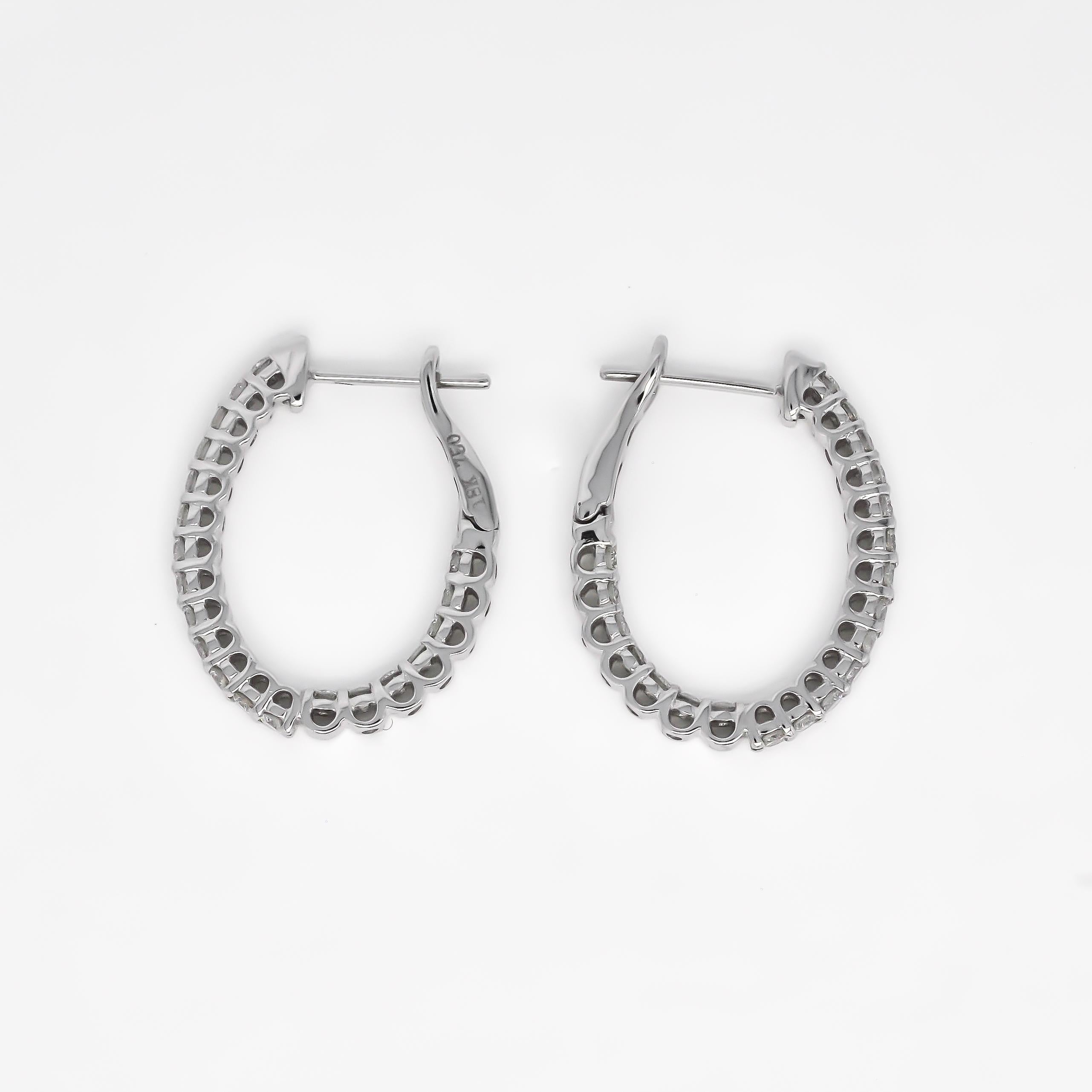 Step into the spotlight with our extraordinary 18KT White Gold Single Row Diamond In and Out Hoop Huggies Earring! Crafted with meticulous precision and unparalleled attention to detail, these hoop huggies are a true testament to the artistry of