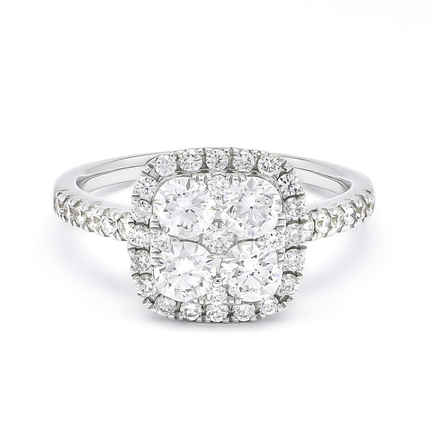 Dieser atemberaubende Diamant-Halo-Cluster-Verlobungsring ist ein wahres Meisterwerk, das mit unvergleichlichem Geschick und handwerklichem Können in 18 Karat Weißgold gefasst wurde. Dieser exquisite Ring zeichnet sich durch einen schillernden
