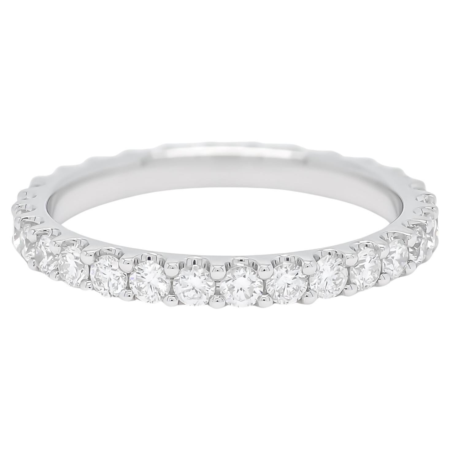 Experience the elegance of this exquisite diamond band, meticulously crafted in lustrous 18K Yellow gold. Each detail of this band exudes sophistication and grace, featuring a continuous row of round-shaped diamonds set in a shared prong setting.