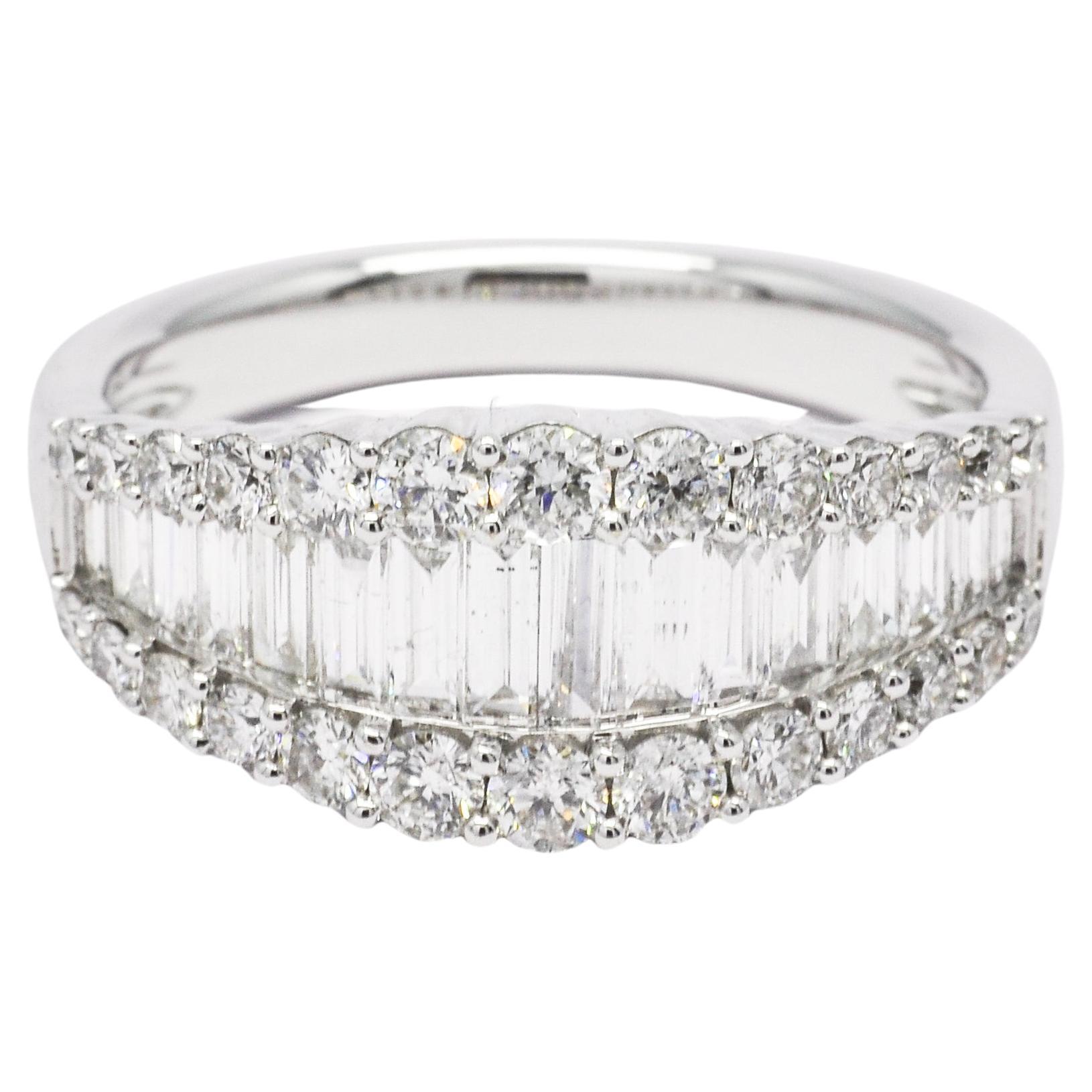 Crafted in 18KT white gold, this stunning wedding band features a mesmerizing combination of baguette and round-cut diamonds set in a channel setting. 

The baguette diamonds create a sleek and modern look, while the round diamonds add a touch of