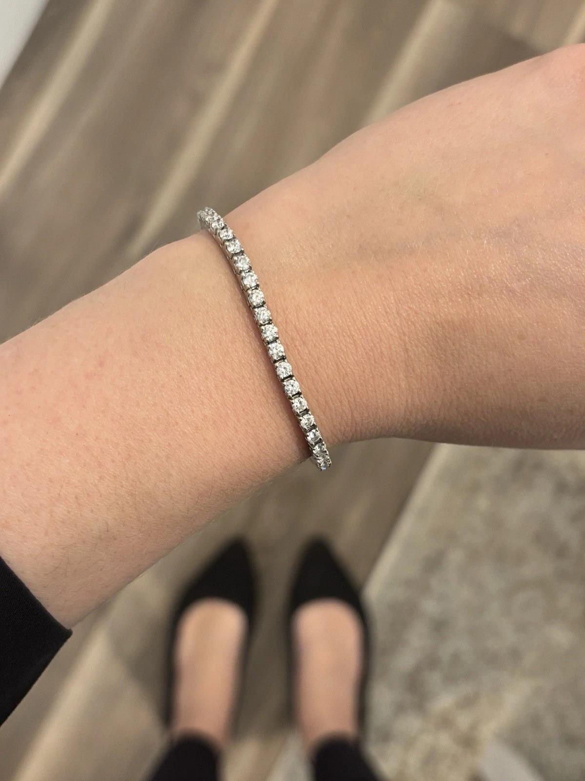 🡆 Item Description:
Elegant diamond tennis bracelet crafted in solid 14K white gold, featuring fifty-one (51) tested natural round brilliant cut diamonds, set in a continuous line with four-prong settings. The bracelet measures 7 inches in length,