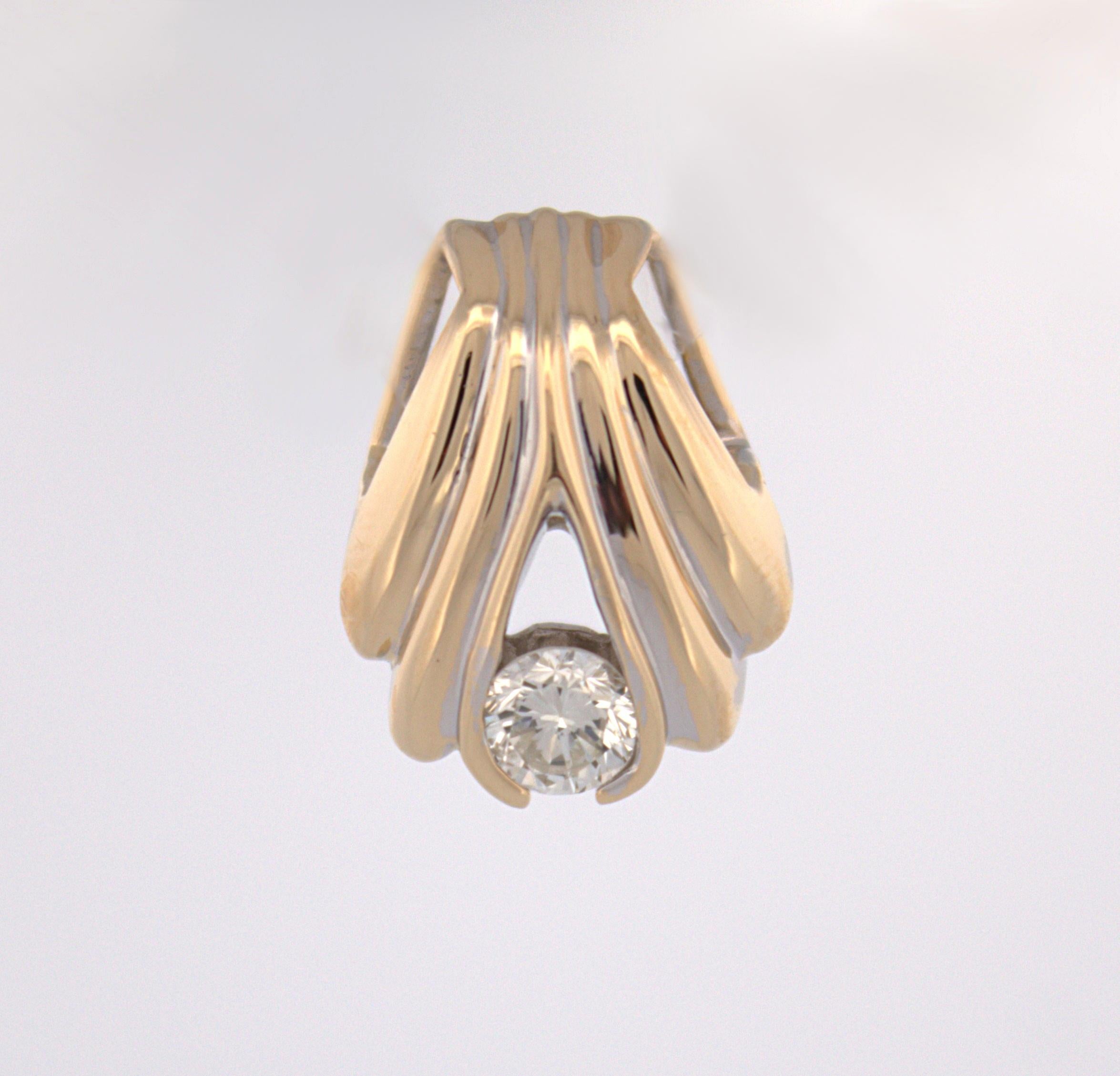 Featuring (1) round brilliant-cut natural diamond, 0.35 ct., VS, I-J, channel set in a 14k yellow gold scalloped slide mounting, 18.2 X 13.7 X 8.2 mm, marked 14K, Gross weight 3.11 grams.