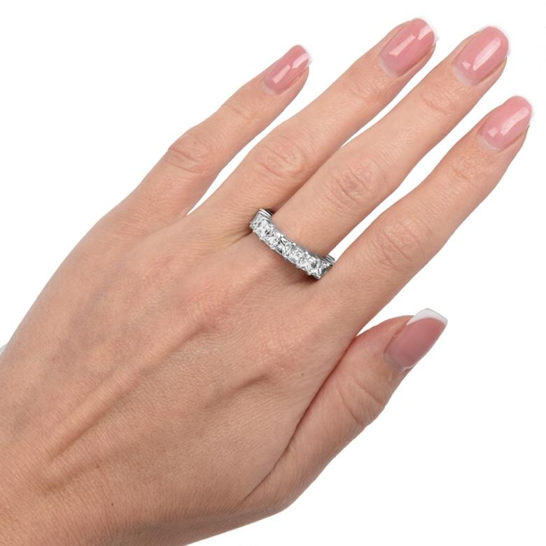 Discover timeless elegance and modern sophistication with our Platinum Princess-Cut Diamond Eternity Band. This contemporary statement piece is crafted to perfection, designed to stand out as a bold solo accessory or to complement your engagement