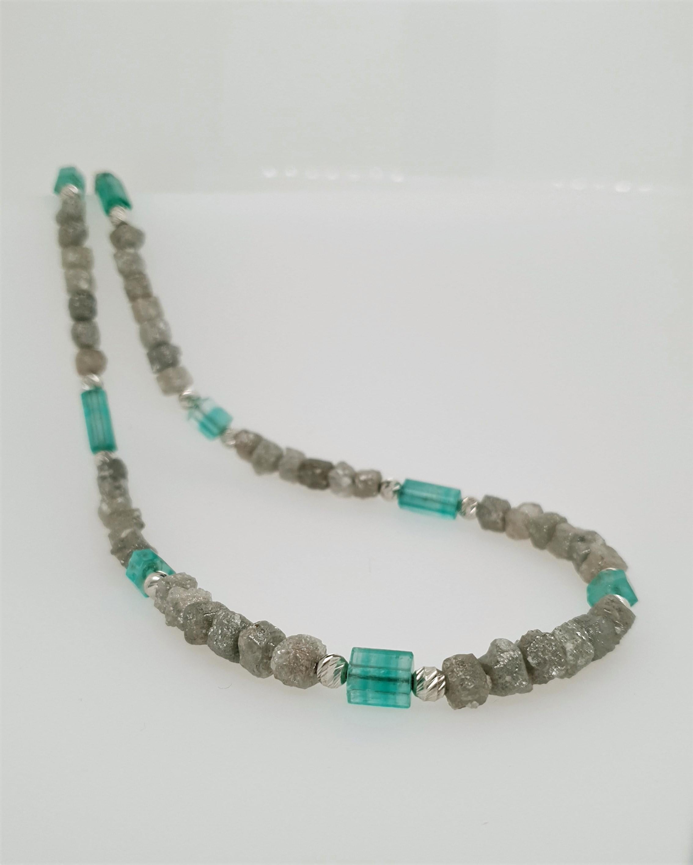 This exceptional natural Diamond and Emerald Crystal Necklace with 18 Carat White Gold is totally handmade.
Hexagonl 18kt white clasp and beads matchs perfectly to the natural crystal shape of the green Emerald.
Cutting as well as goldwork are made