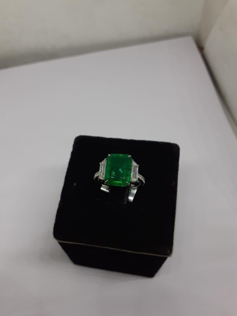 Diamonds : 1.20 carats
Emerald : 5.32 carats
Gold : 4.08 gms

It’s very hard to capture the true color and luster of the stone, I have tried to add pictures which are taken professionally and by me from my I phone to reflect the true image of the