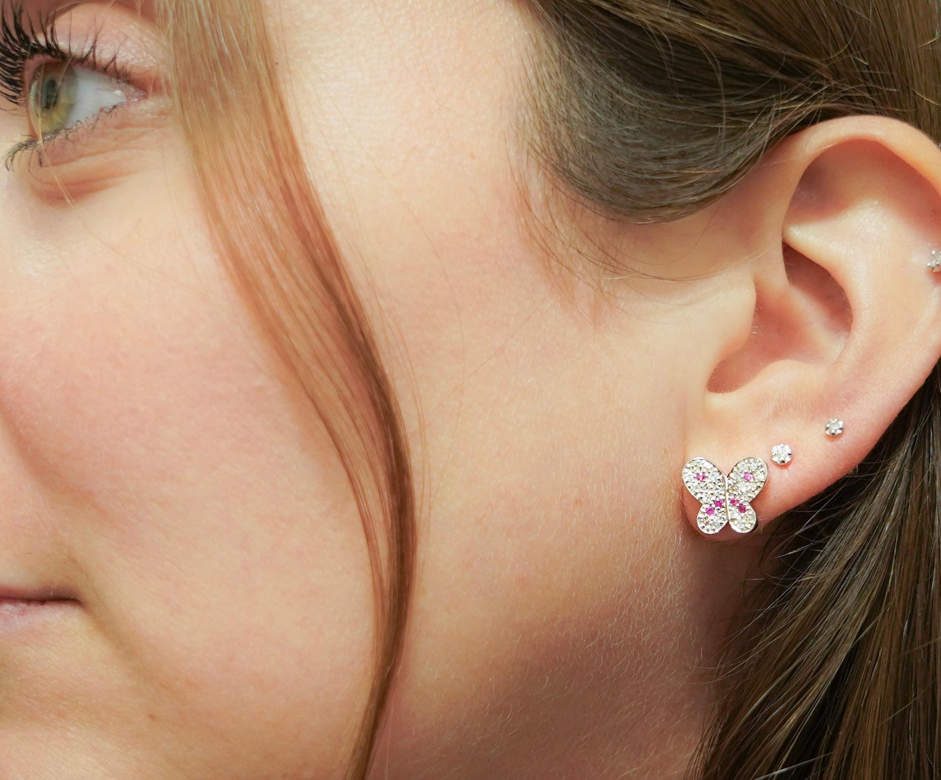 Simple yet classy natural diamond and pink sapphire butterfly stud earrings. Securely pave set for optimal brilliance and sparkle. Set in 14k solid white gold with butterfly push-back closure.

Hypoallergenic, waterproof, and lightweight for a