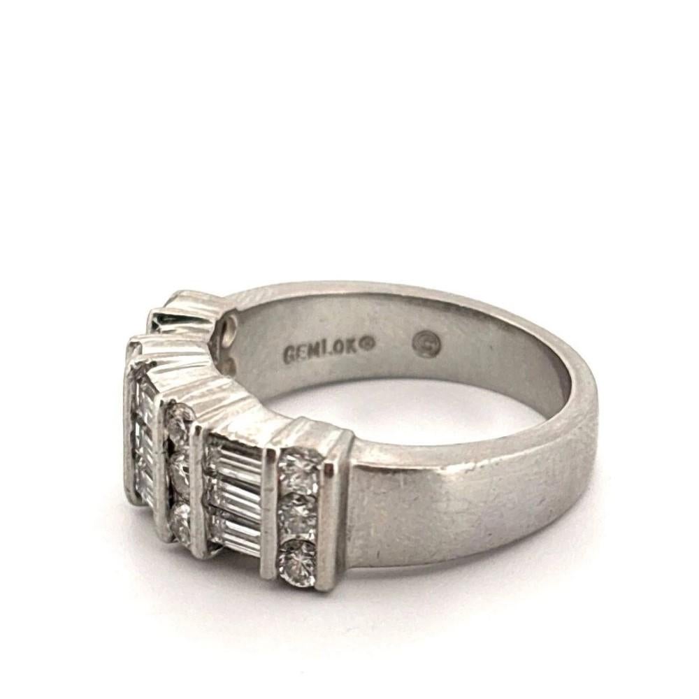 Here is an elegant and iconic Gemlok 3-row diamond ring, masterfully crafted in solid platinum. This designer piece features alternating rows of VS clarity, F–G color diamonds—12 round brilliant-cut diamonds weighing approximately 0.65 carats and 9