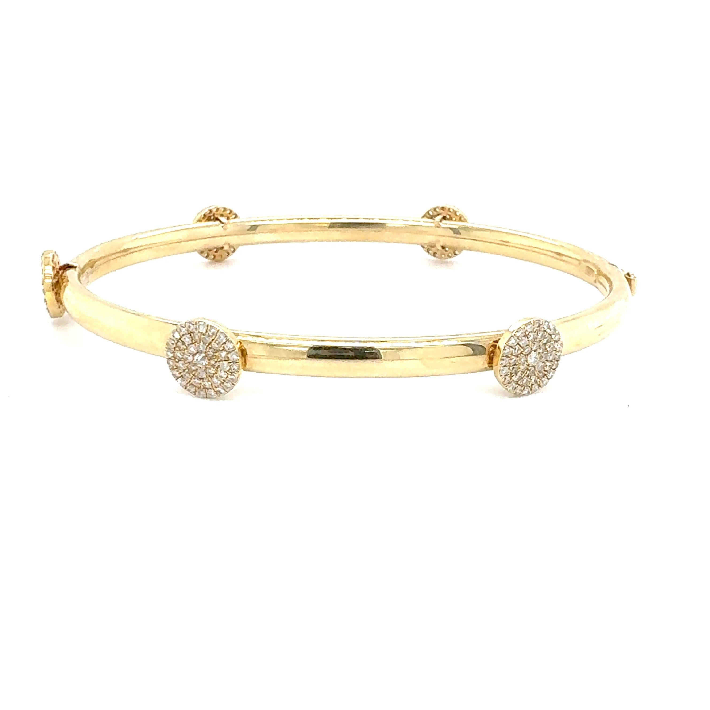 A natural 0.95-carat diamond bangle bracelet set in 14-Kt yellow gold. 