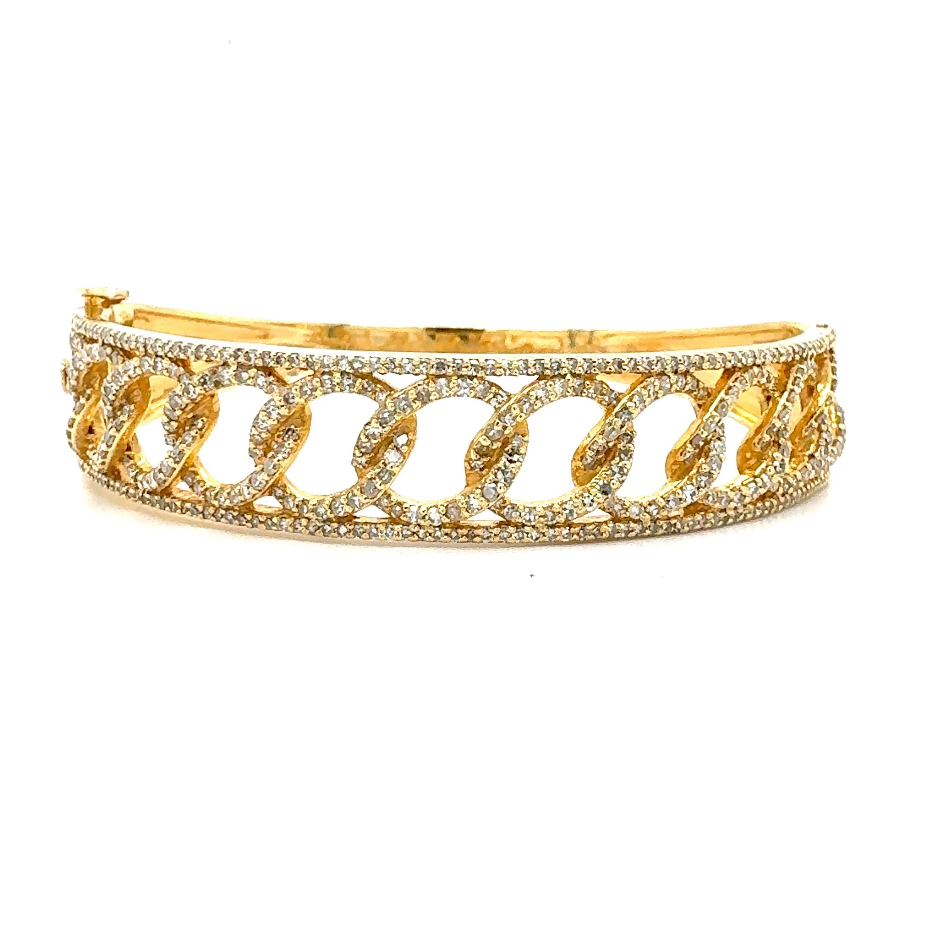 A natural 2.18-carat natural diamond solid bangle bracelet set in 14-Kt yellow gold. 