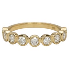 Natural Diamond Bezel Half Eternity Wedding Band in 14k Yellow Gold
