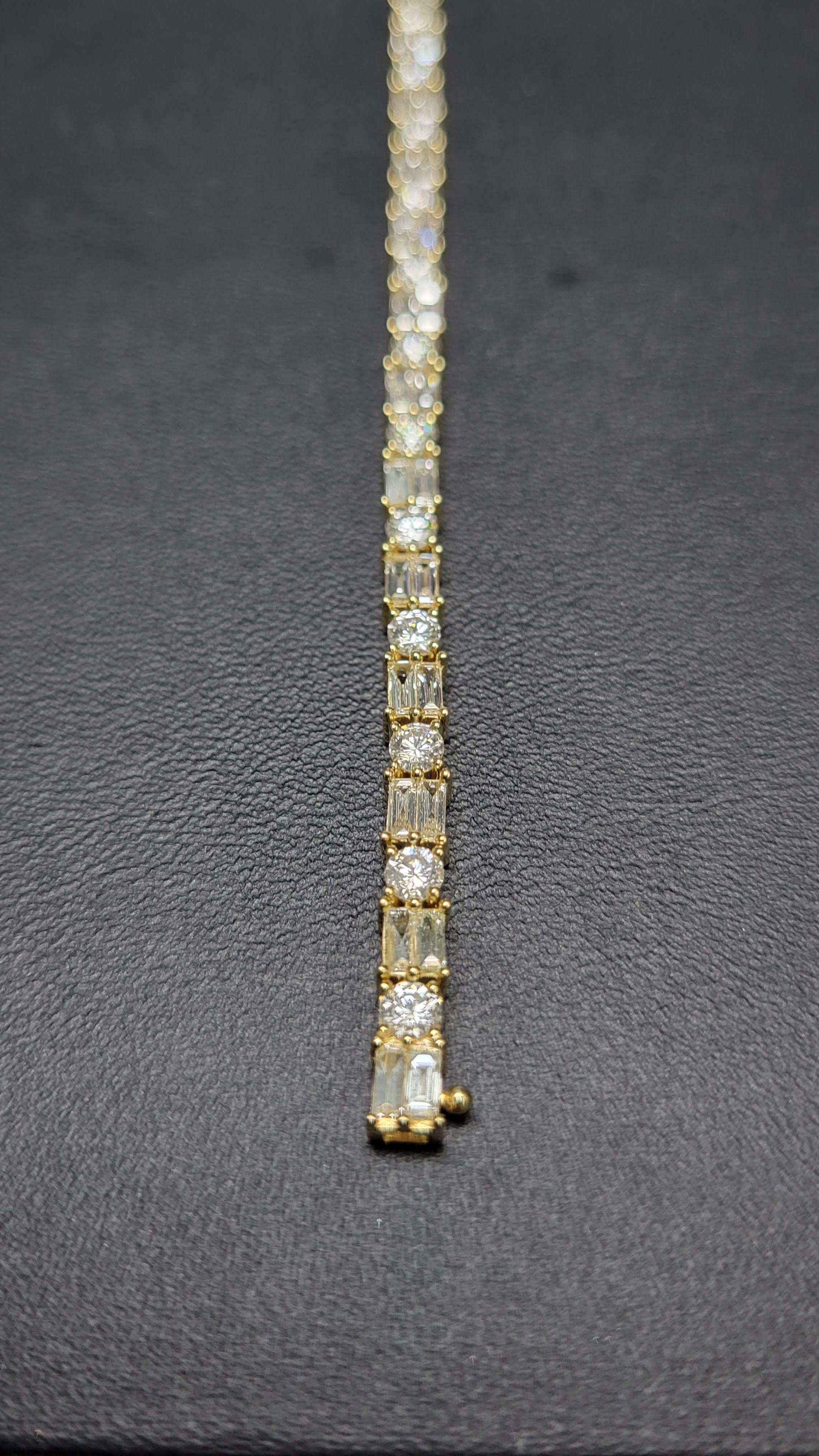 Simple yet brilliant, this classic diamond bracelet features round and baguette diamonds framed in 18K yellow gold.

Lot #: 04617

18K/Y Gold: 9.61g

White Diamond Weight: 
4.28cts
