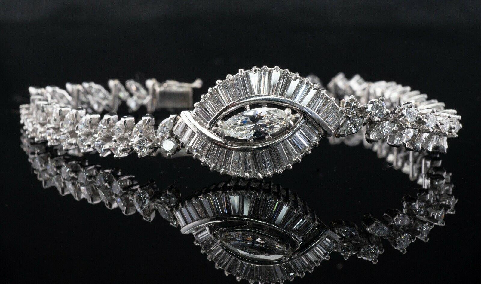 Natural Diamond Bracelet Platinum 8.15 TDW Vintage

This gorgeous vintage bracelet is crafted in Platinum and 14K White Gold for the clasp.
The center piece holds one marquise cut diamond = .85 carat. This is a SI-1 clarity and G color stone.
The
