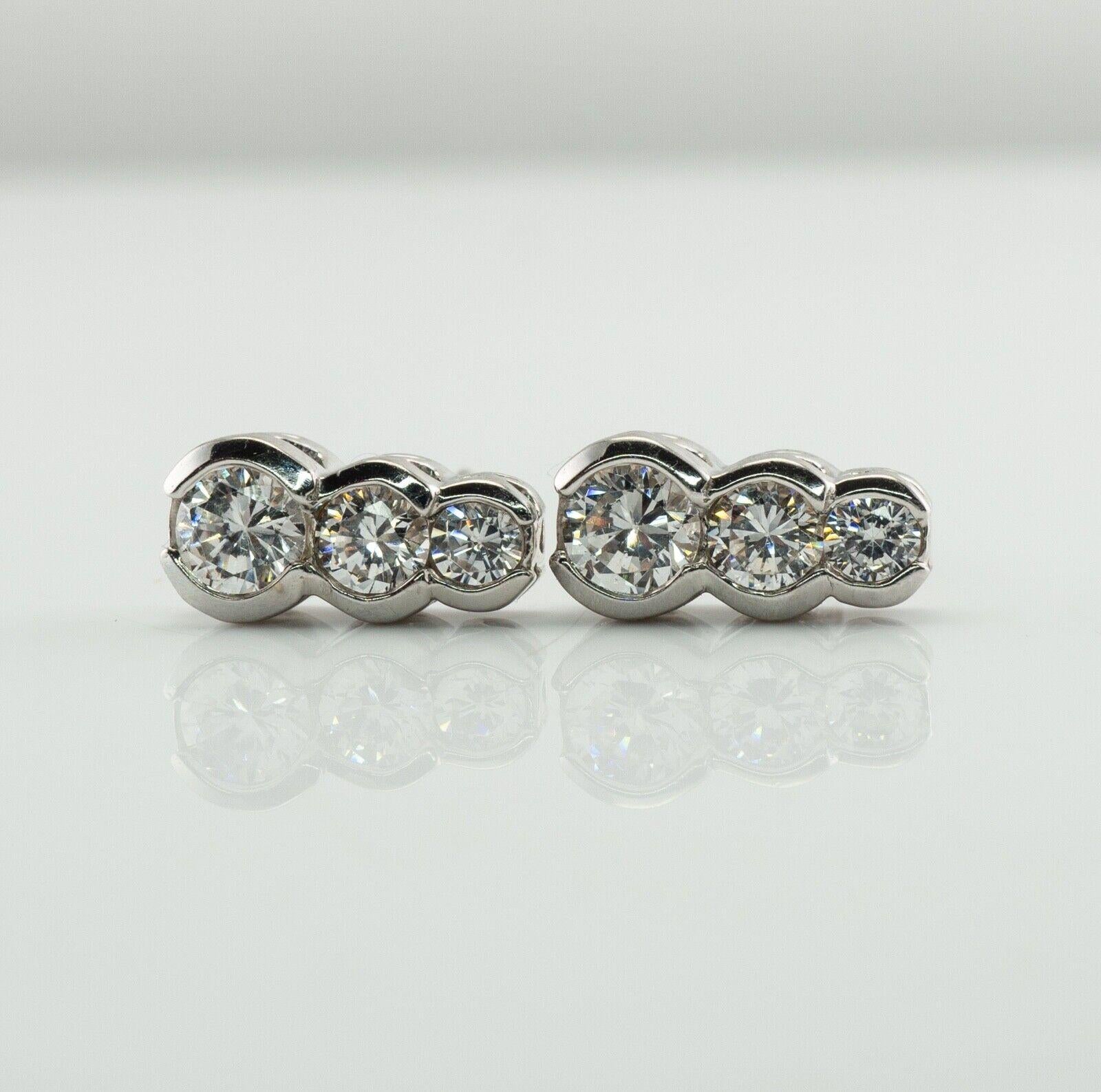 Round Cut Natural Diamond Earrings 14k White Gold .90 TDW Three Stones For Sale