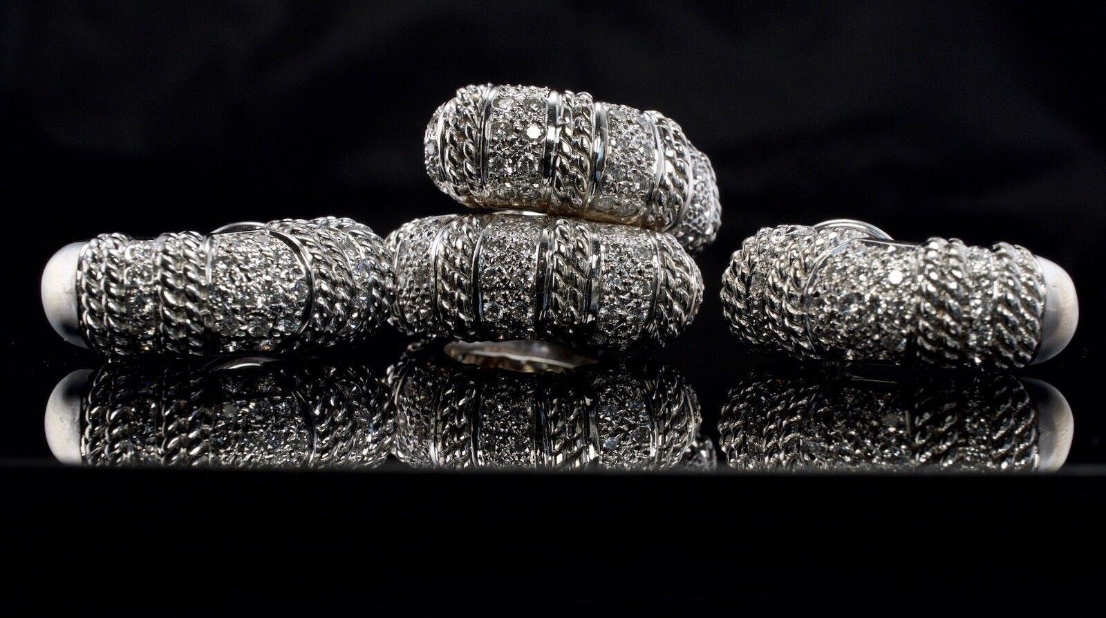 Cassis Diamond Earrings Ring Set 18K White Gold 1.82 TDW

This glorious set is finely crafted in solid 18K White Gold by Cassis. 
The bypass ring has 132 diamonds for the total 1.32 carats. 
The diamonds are estimated to be SI1 clarity and H color.