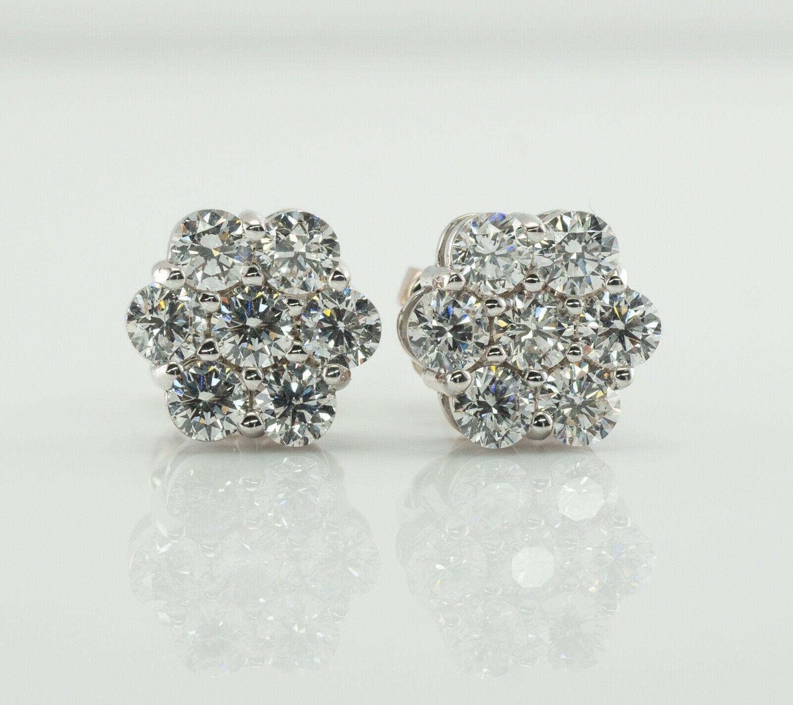 Natural Diamond Earrings Studs 14K White Gold Cluster 1.12 TDW

This pair of diamond cluster studs is crafted in solid 14K White Gold. 
There are seven natural round brilliant cut diamonds totaling 1.12 carats for the pair. 
The diamonds are VS2-SI1