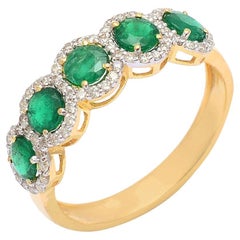 Anillo de oro con diamante natural y esmeralda de 14k
