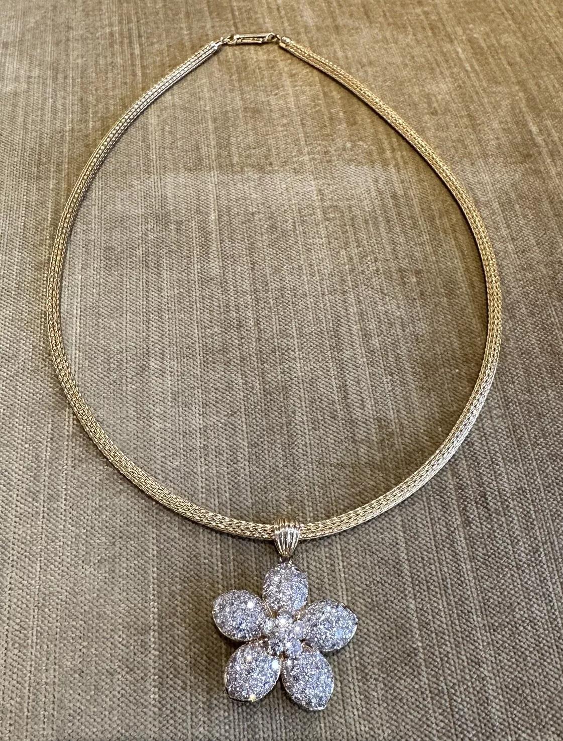 Natural Diamond Flower Pendant Necklace 4.43 carat total weight in 18k Yellow Gold

Natural Diamond Flower Pendant Necklace features a large Diamond Flower Pendant with 5 petals pave set with Round Diamonds and a center cluster of 6 Round Diamonds,