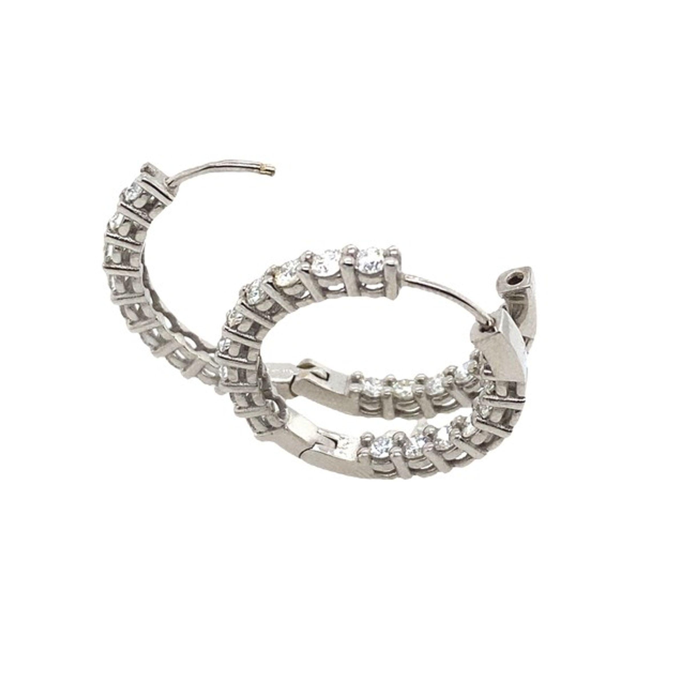 This pair of hinged hoop earrings was designed to be the perfect everyday earring.
It features a total of 1.80ct Diamonds mounted on a 14ct White Gold hoop.
It is hinged, allowing it to swing from the ear.

Additional Information: 
Total Weight: