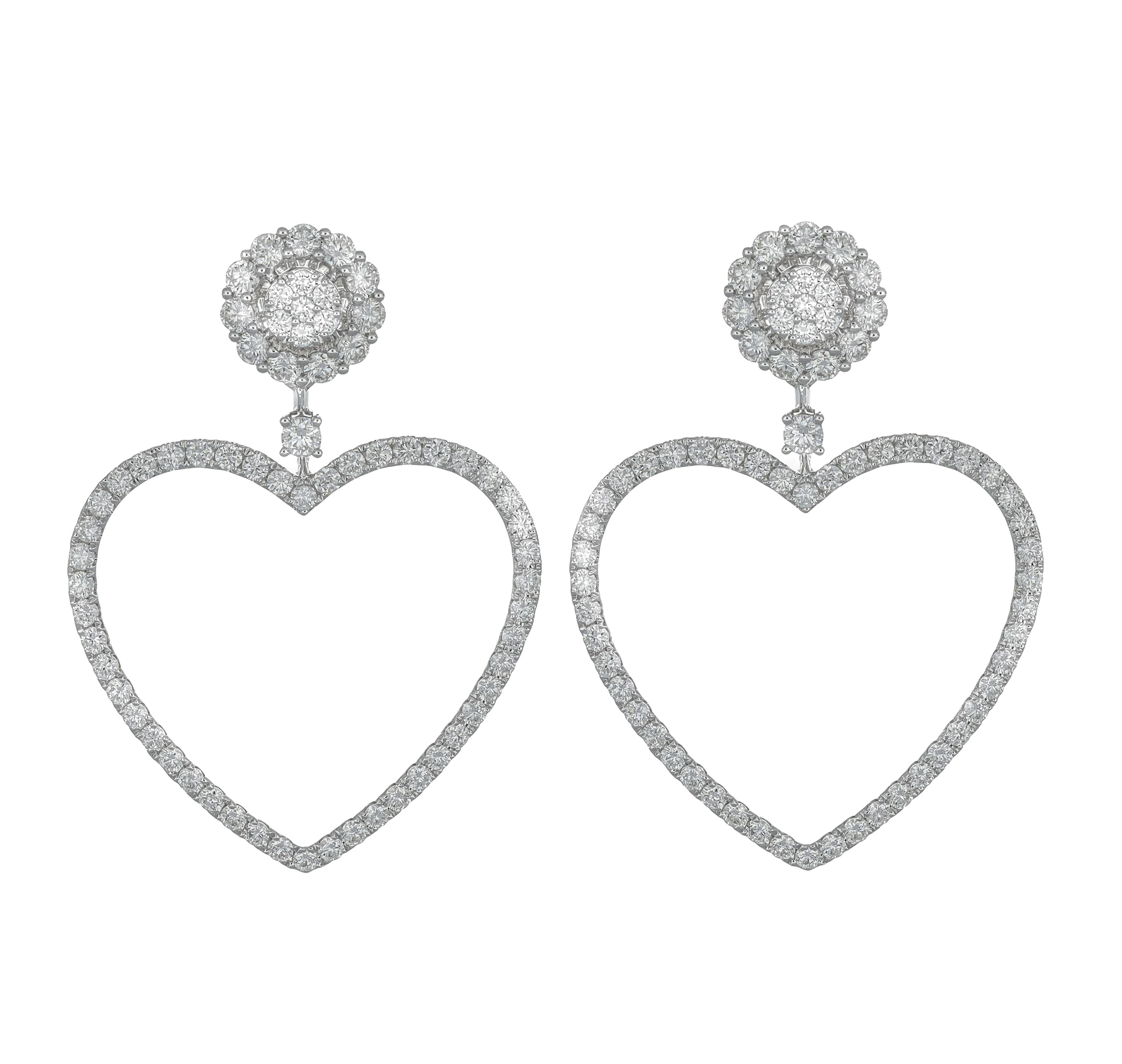 Indulge in the epitome of glamour and sophistication with these exquisite heart-shaped diamond single row hoop earrings, adorned with a cluster stud, crafted in lustrous 18 karat white gold. These earrings are a captivating embodiment of elegance,
