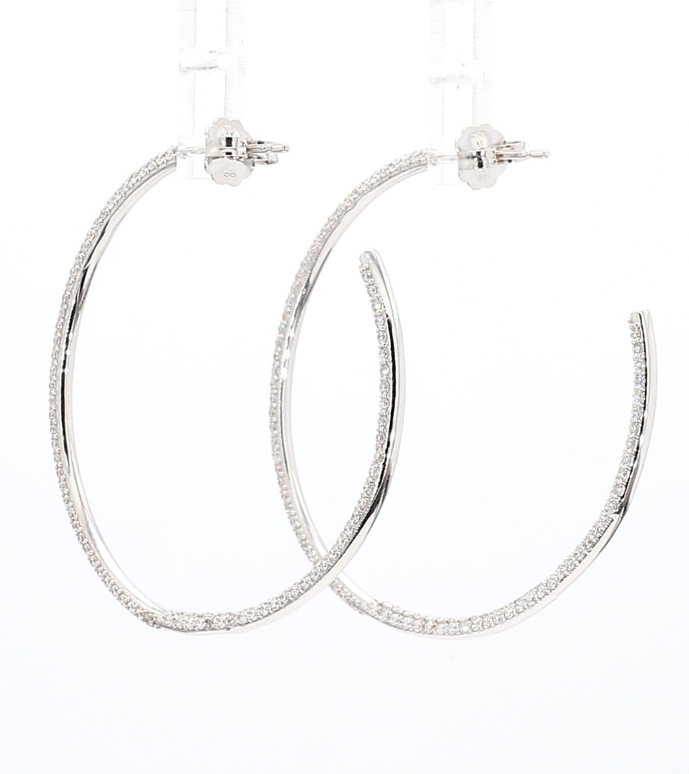A rare intricately set *three-row* pair of Diamond Hoop Earrings

In-and-out Diamond Hoop Earrings Set in 14K White Gold

2.14 carats total weight [454 stones] 0.05 Ct (each stone)

A work of art. Please check the photos to see the intricate