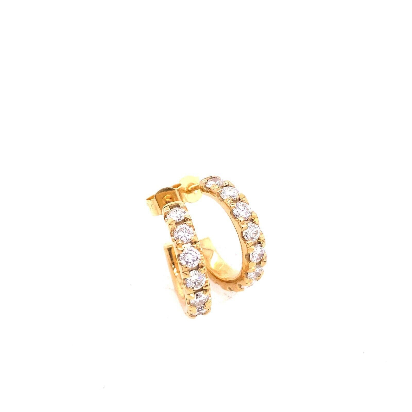 This pair of  hoop earrings was designed to be the perfect everyday earring. 
It features 11 round brilliant cut Diamonds on each earring  mounted on a 14ct Yellow Gold hoop. 

Additional Information: 
Total Weight: 4.2g 
Total Diamond Weight: