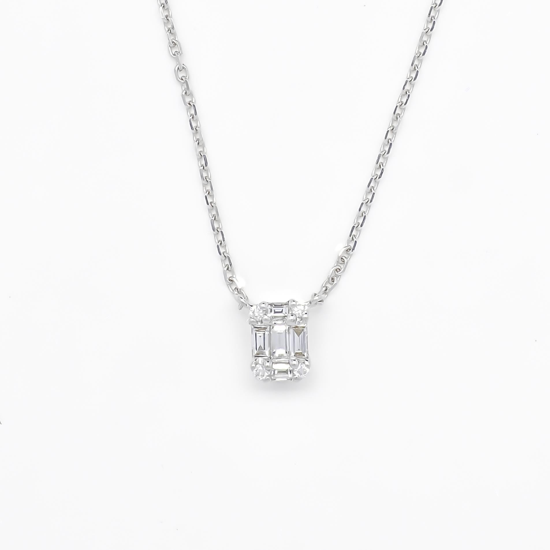 Au-delà du simple luxe, découvrez l'éclat éthéré incarné par cet ensemble collier pendentif et boucles d'oreilles en diamants assortis. 

Le collier à pendentif est la pièce maîtresse de cet ensemble et n'est rien de moins qu'un chef-d'œuvre.