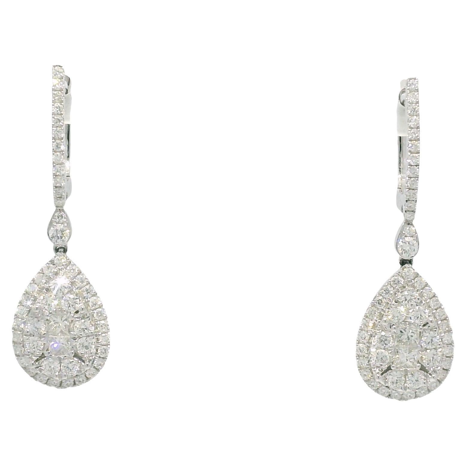 18 Karat White Gold 1.56 Carat Diamond Mosaic Tear Drop Earrings
Material: 18 Karat White Gold
Diamond Details: There are approximately 1.56 carats of Round Brilliant and Princess cut Diamonds. All diamonds are approximately G/H in color and