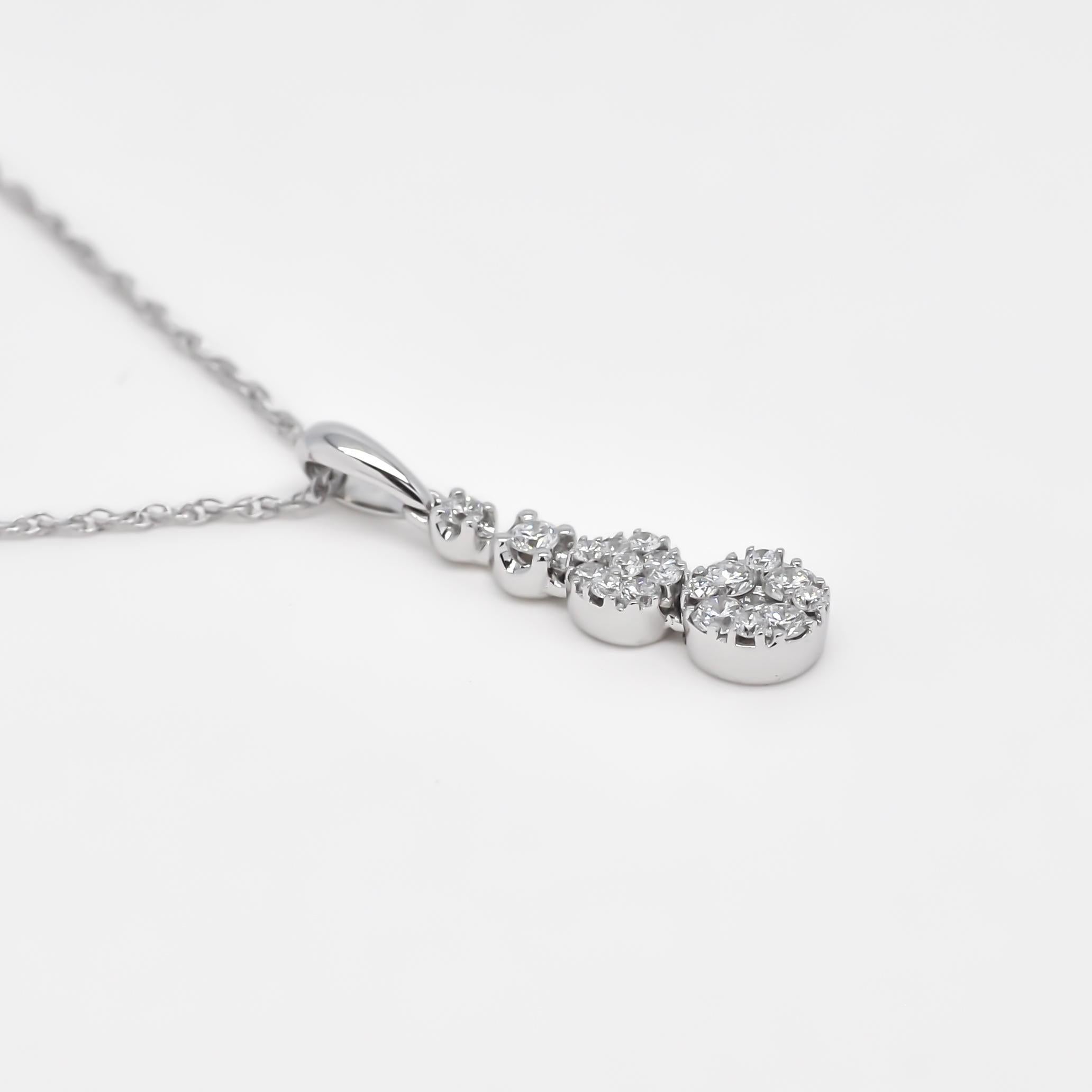 Enhance your wardrobe with the subtle yet captivating allure of this natural diamond pendant necklace. This exquisite piece boasts a total diamond weight of 0.27 carats, featuring four brilliant diamonds that are artfully clustered together. 

The