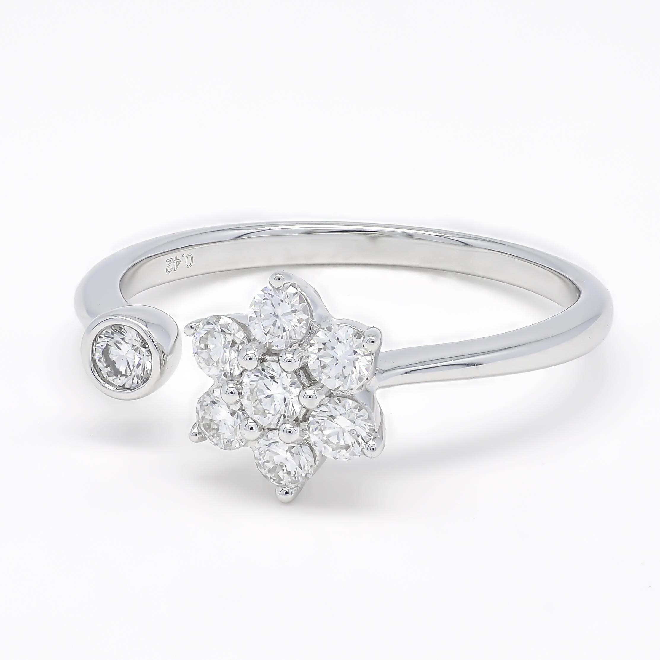 The solitaire cluster open shank modern ring is a contemporary take on the classic solitaire engagement ring design. This ring features a cluster of smaller diamonds arranged in a flower shape, set in a sleek and open shank band.

The open shank