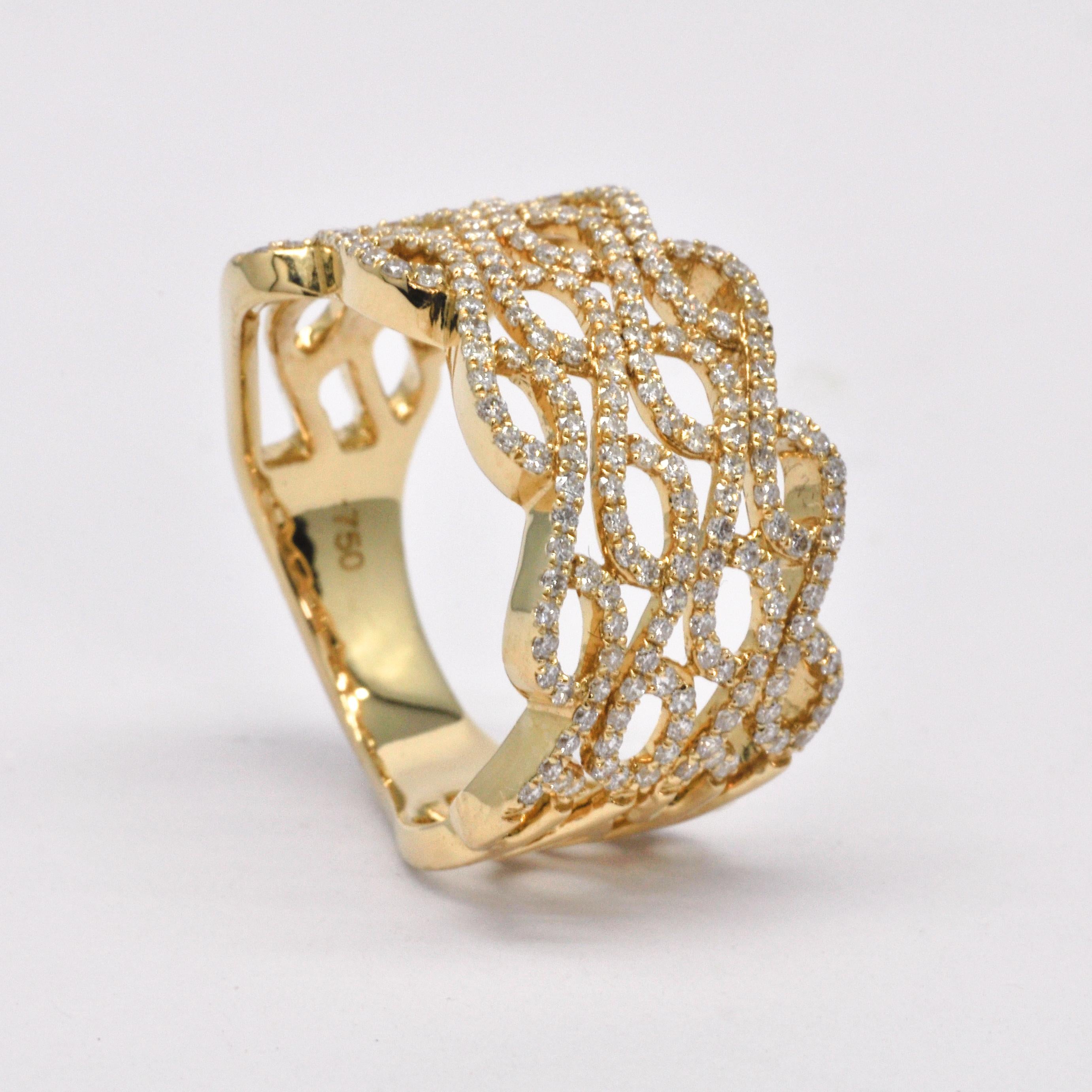 This elegant 18kt gold ring is a true masterpiece, featuring a beautifully carved pattern that adds a touch of sophistication and style to the design. The ring is adorned with pave set round natural diamonds, which add a touch of sparkle and glamour