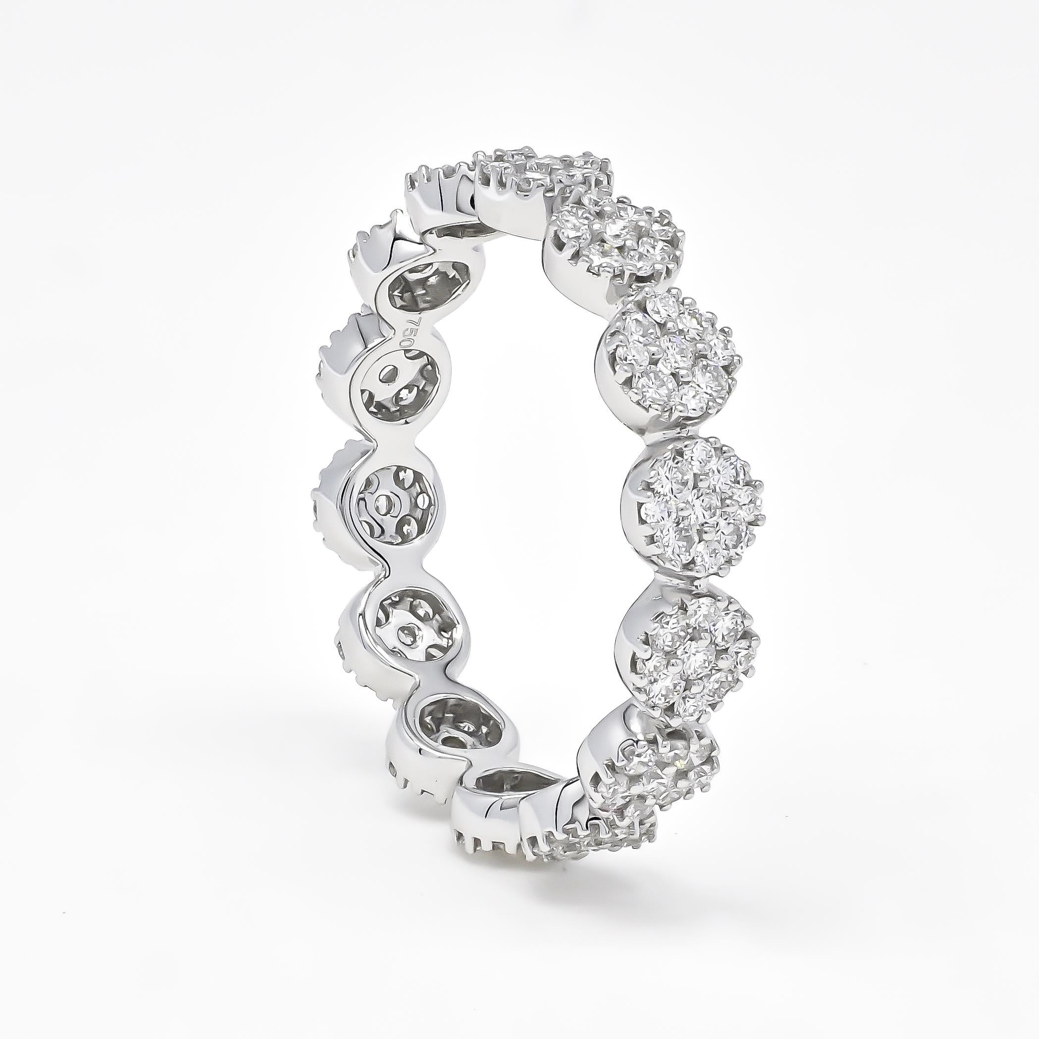 This Natural Diamond Ring is a stunning piece of jewelry that perfectly captures the essence of timeless elegance and sophistication. It features an impressive 1.25 carats of round diamonds, meticulously set in 18 karat white gold to create a